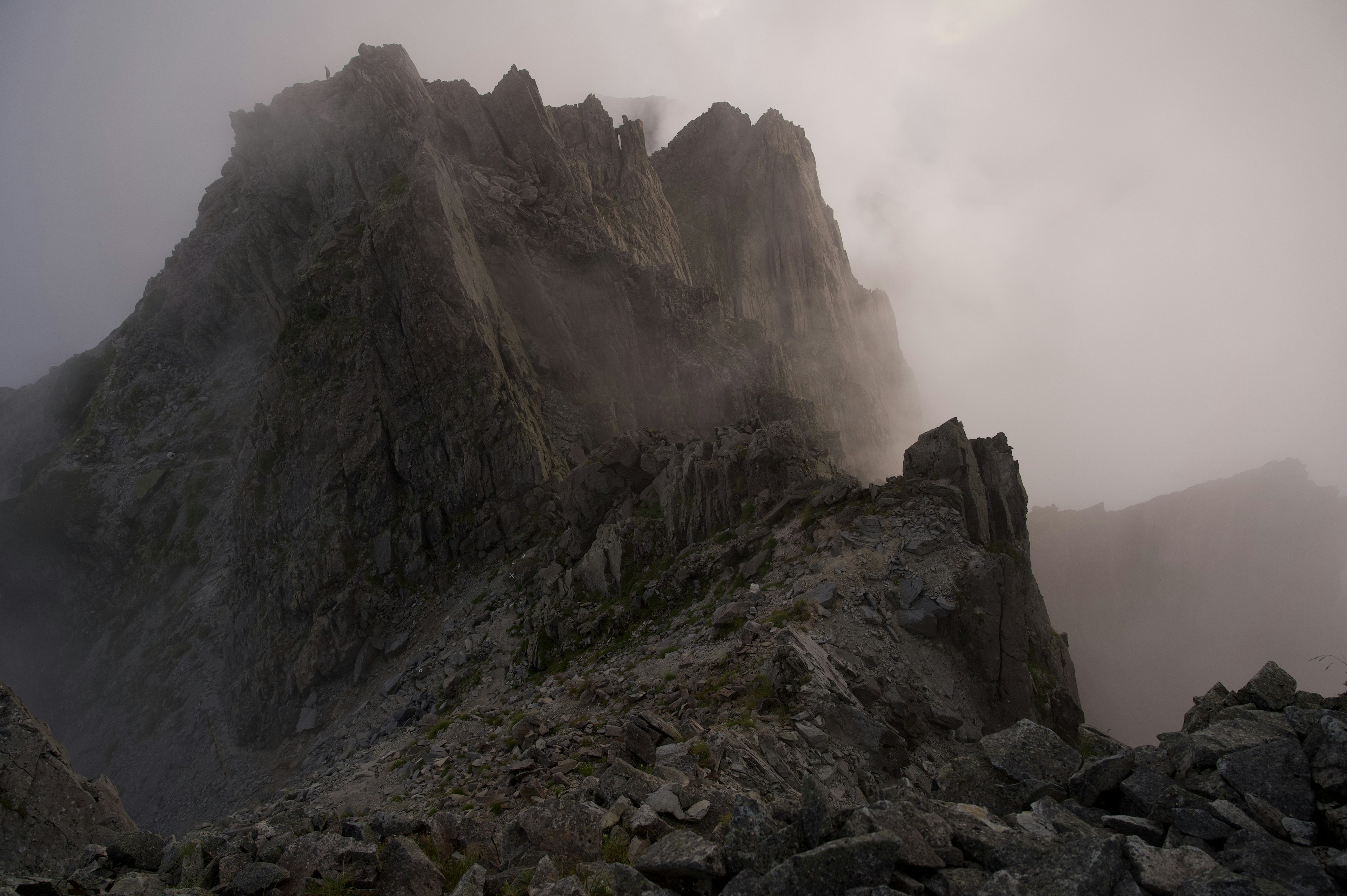 Imposing mountain peaks shrouded in mist