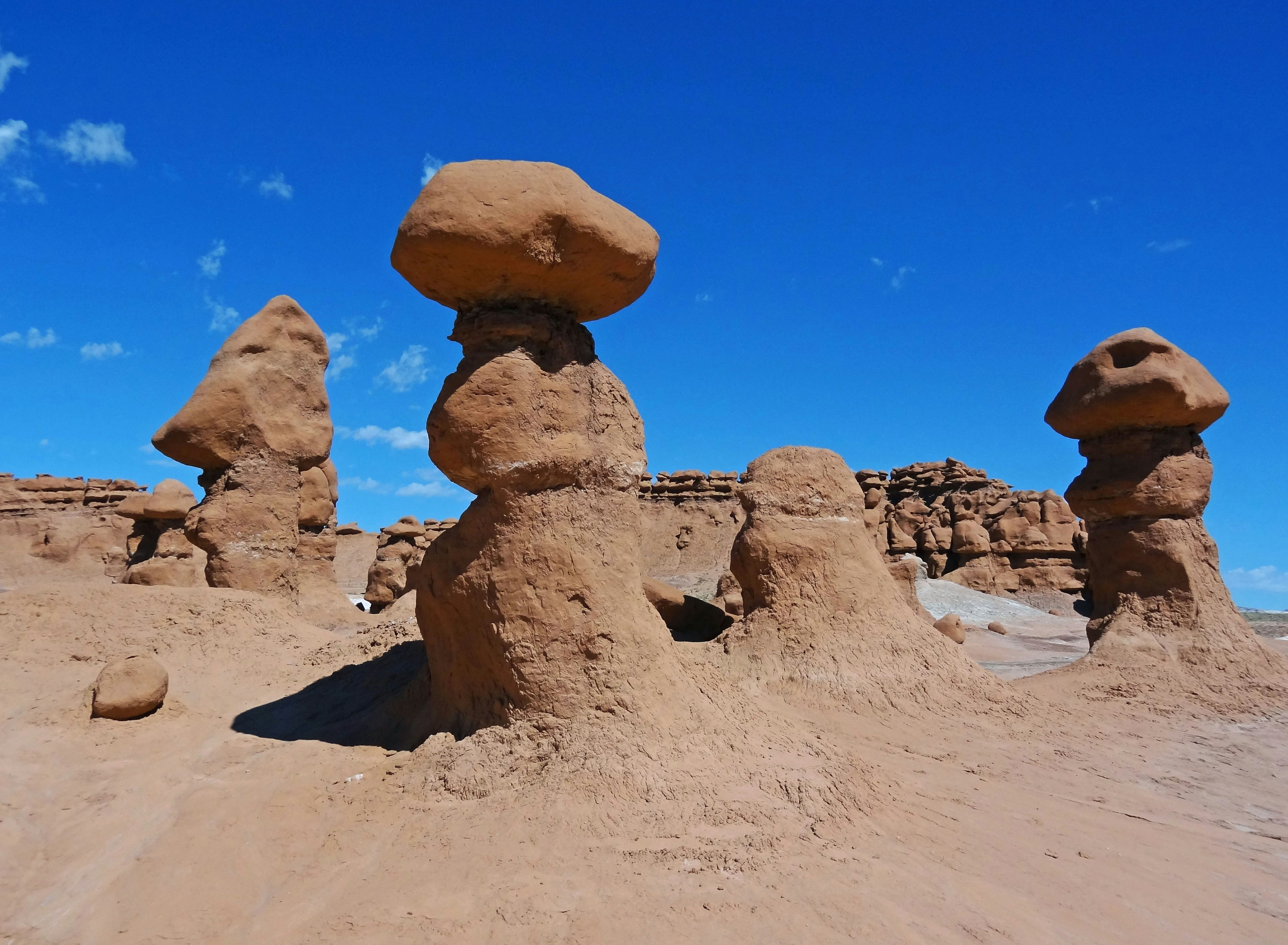 Unique rock formations under a clear blue sky