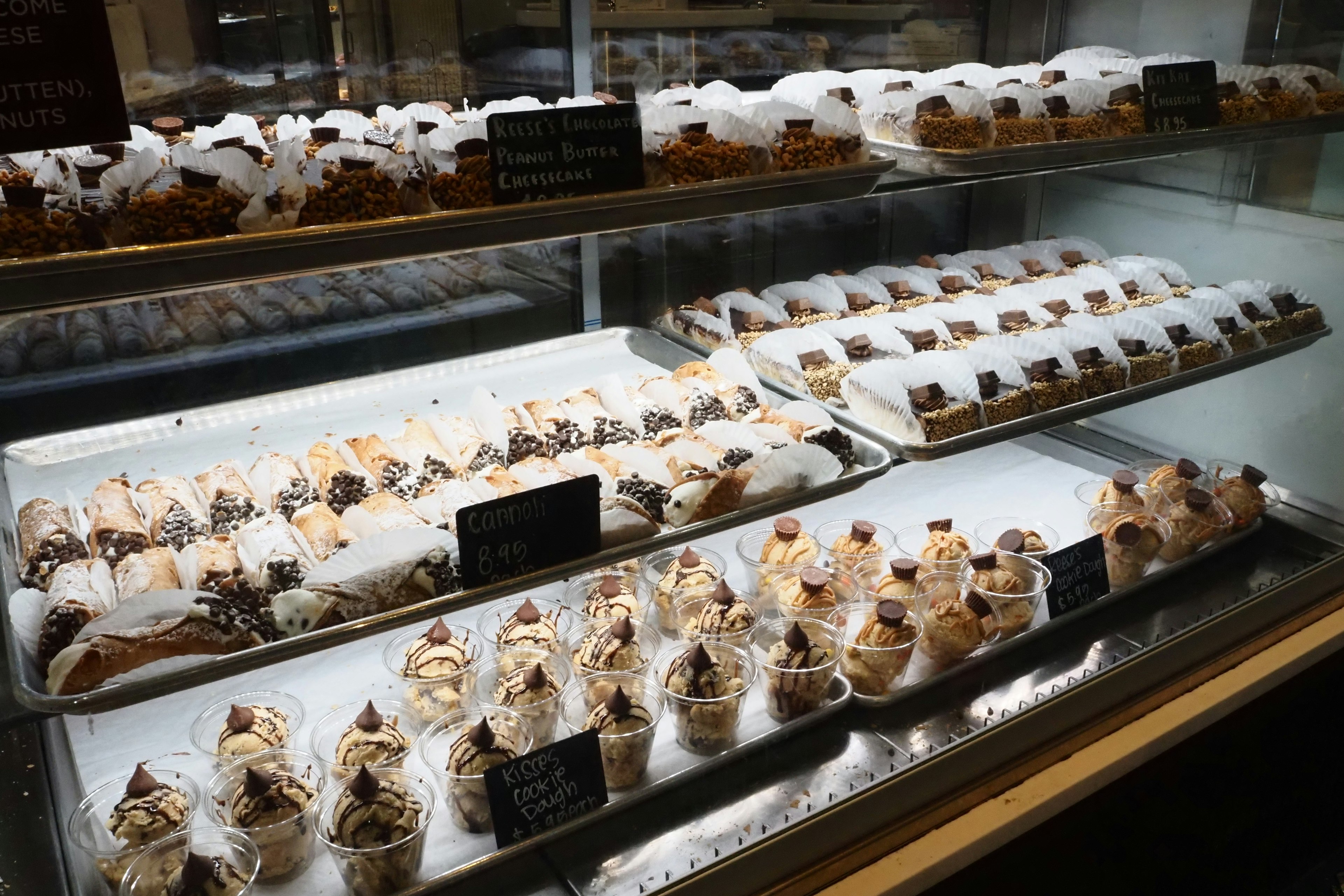 A display case filled with an assortment of delicious desserts