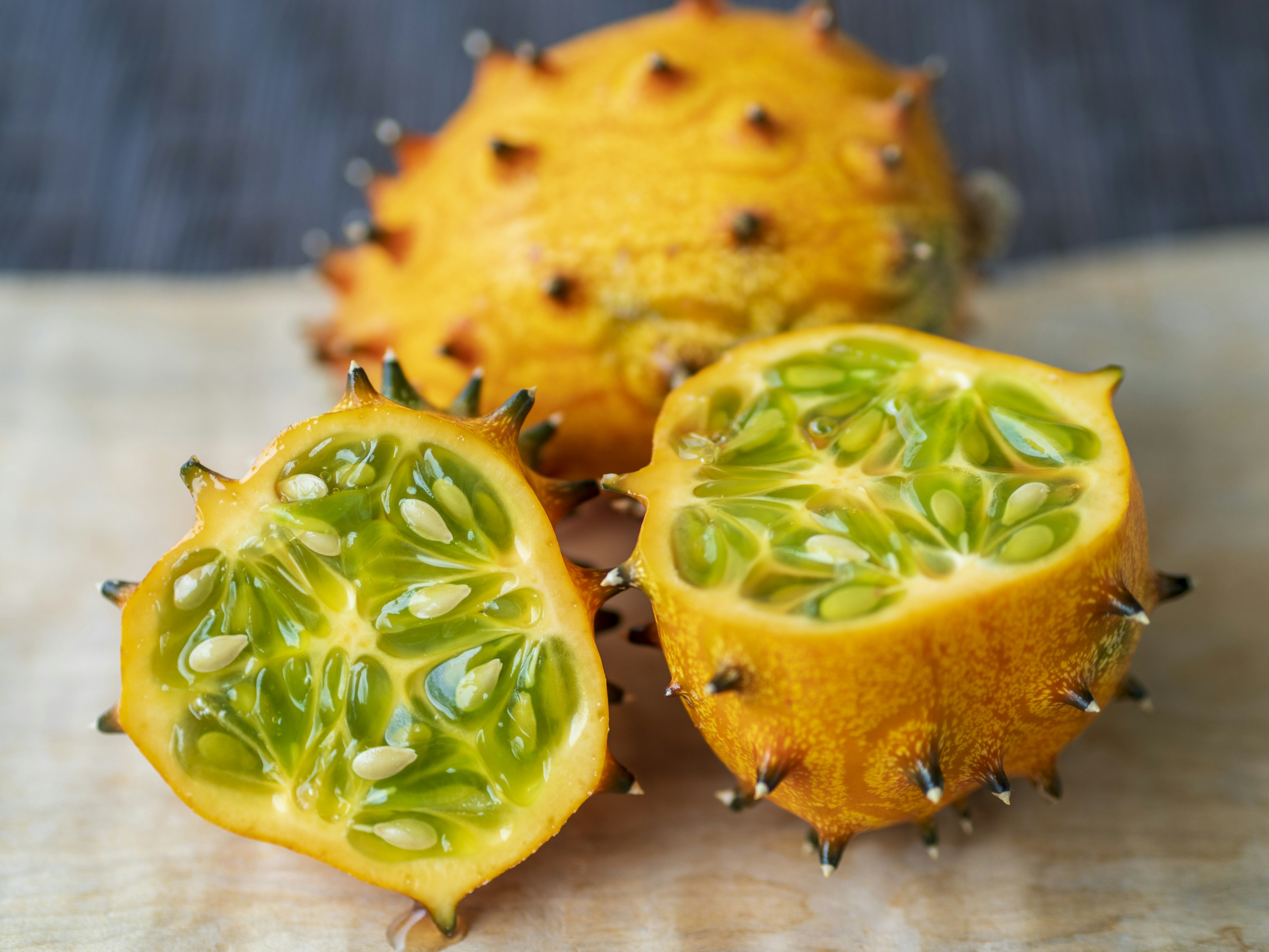 Spiky yellow fruit with green flesh inside