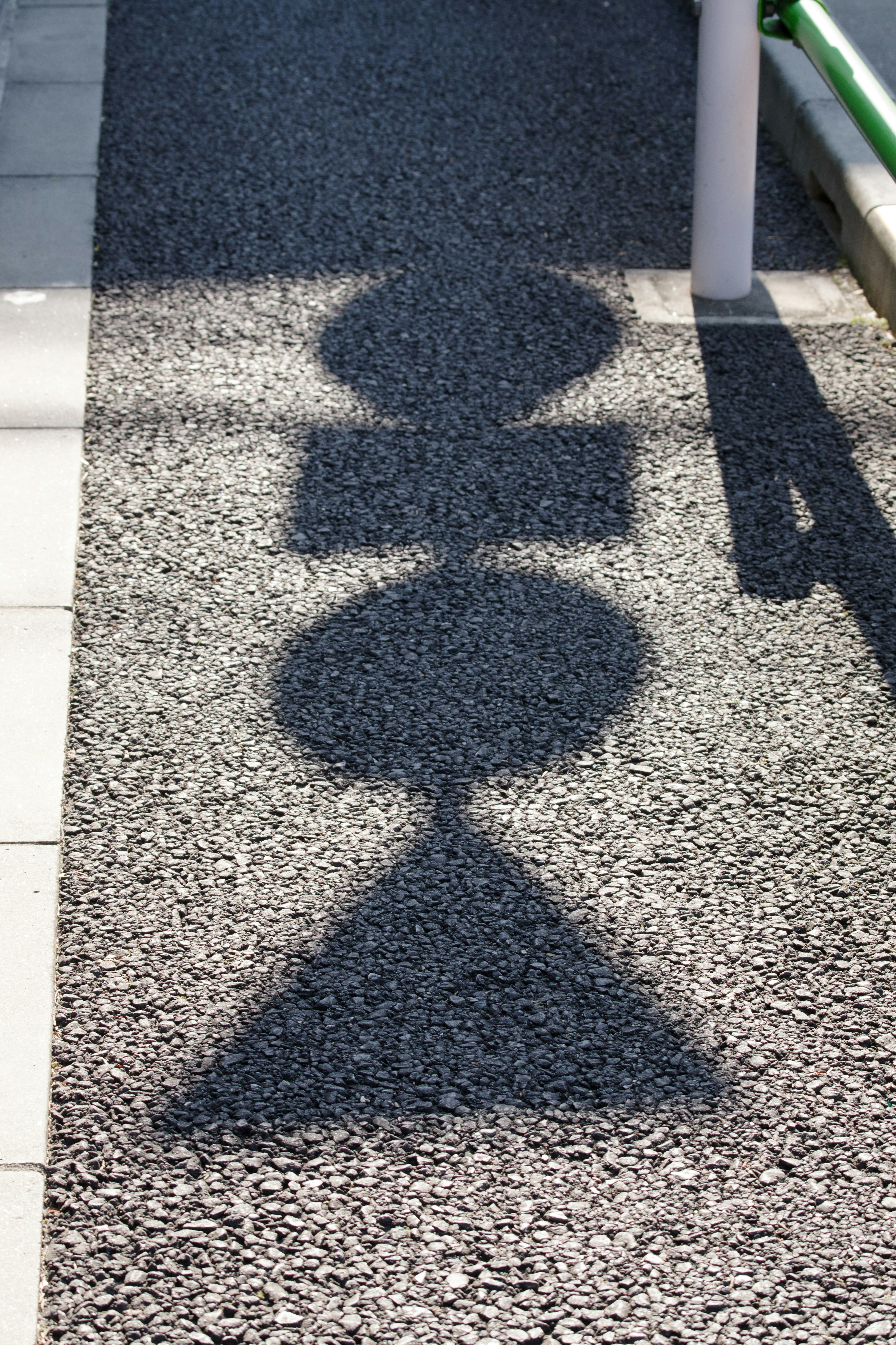 Shadow shapes on a textured pavement