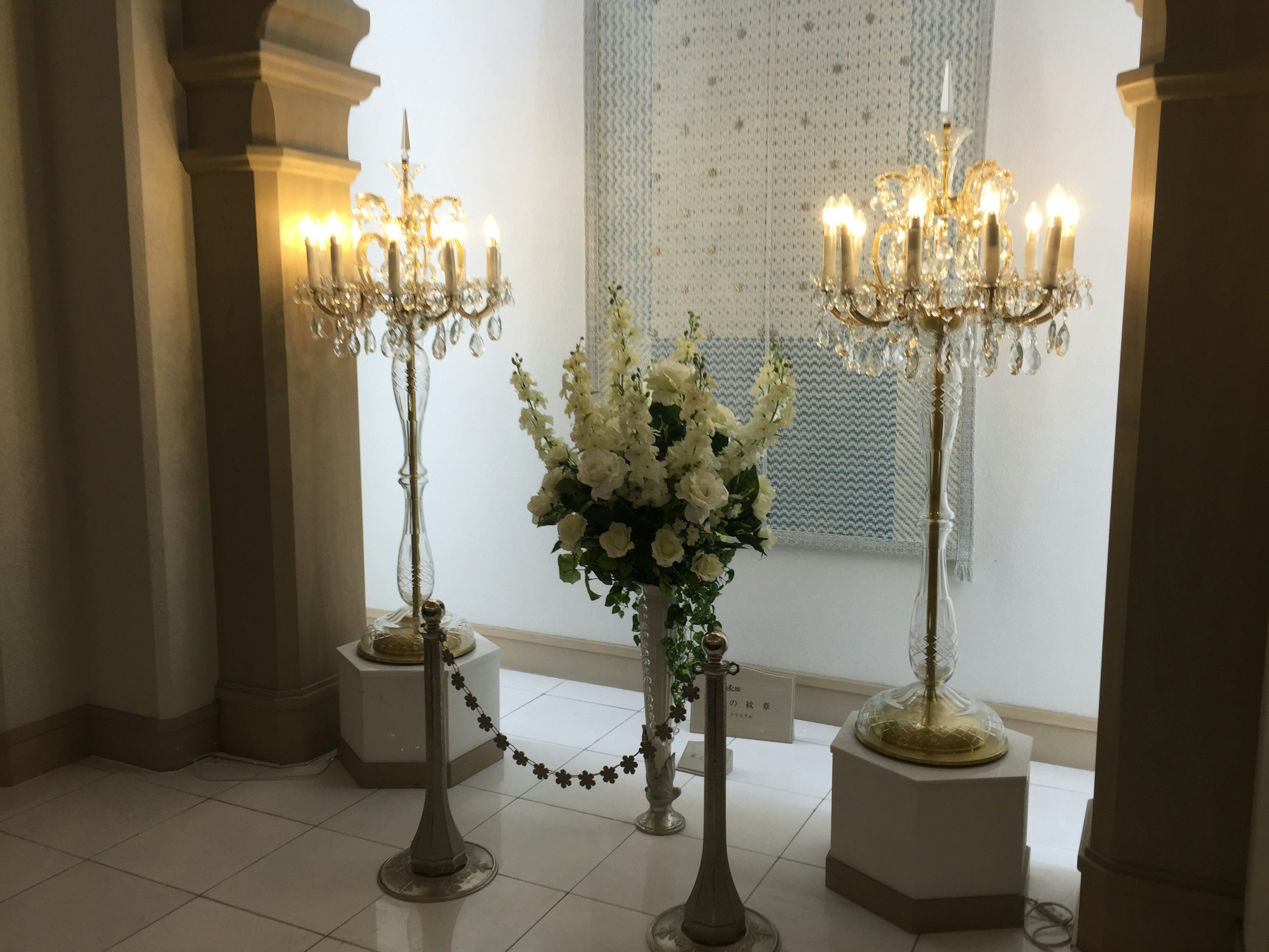 Elegant chandeliers and floral arrangements in a beautiful lobby corner