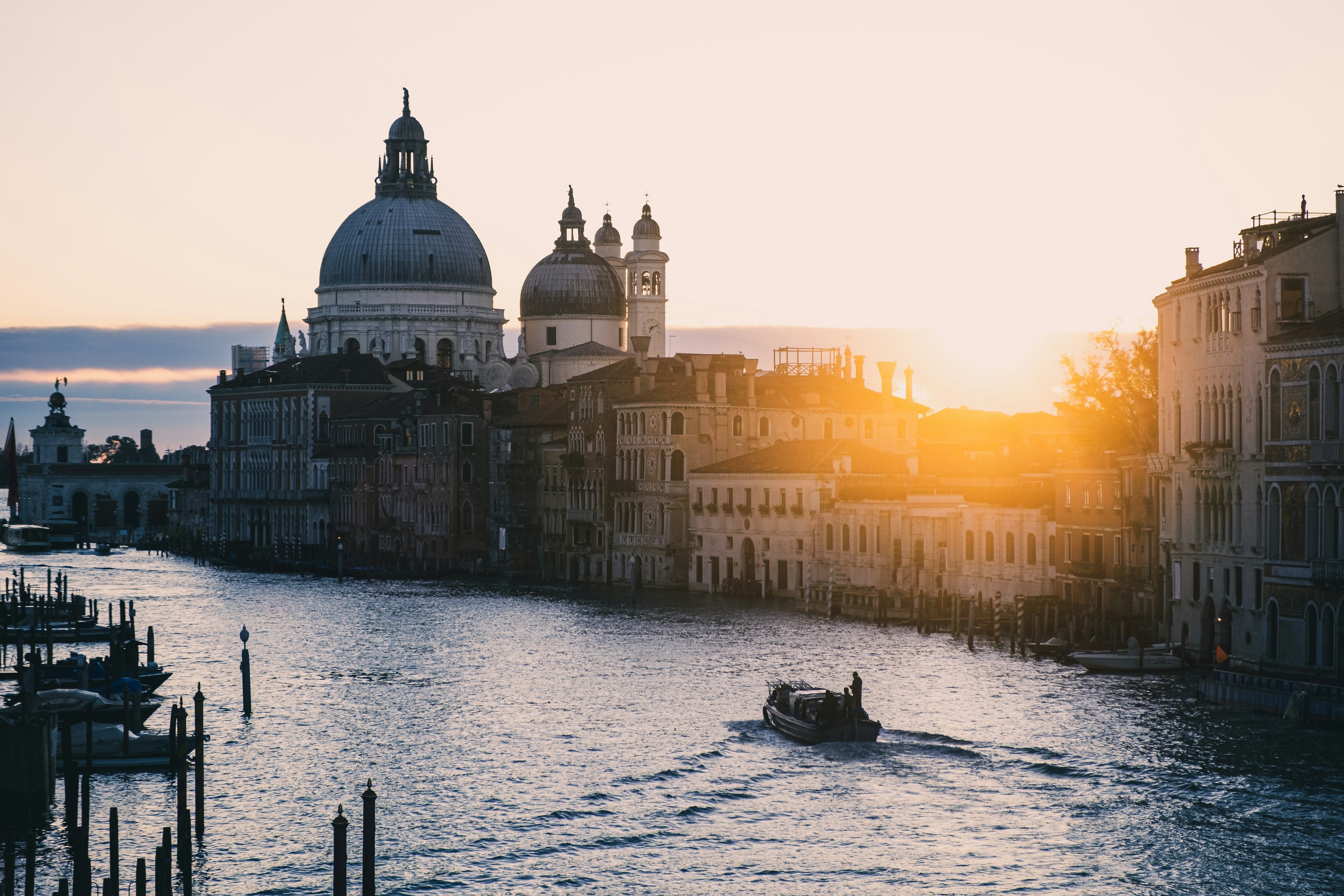 Venice canal at sunset with silhouette of Santa Maria della Salute