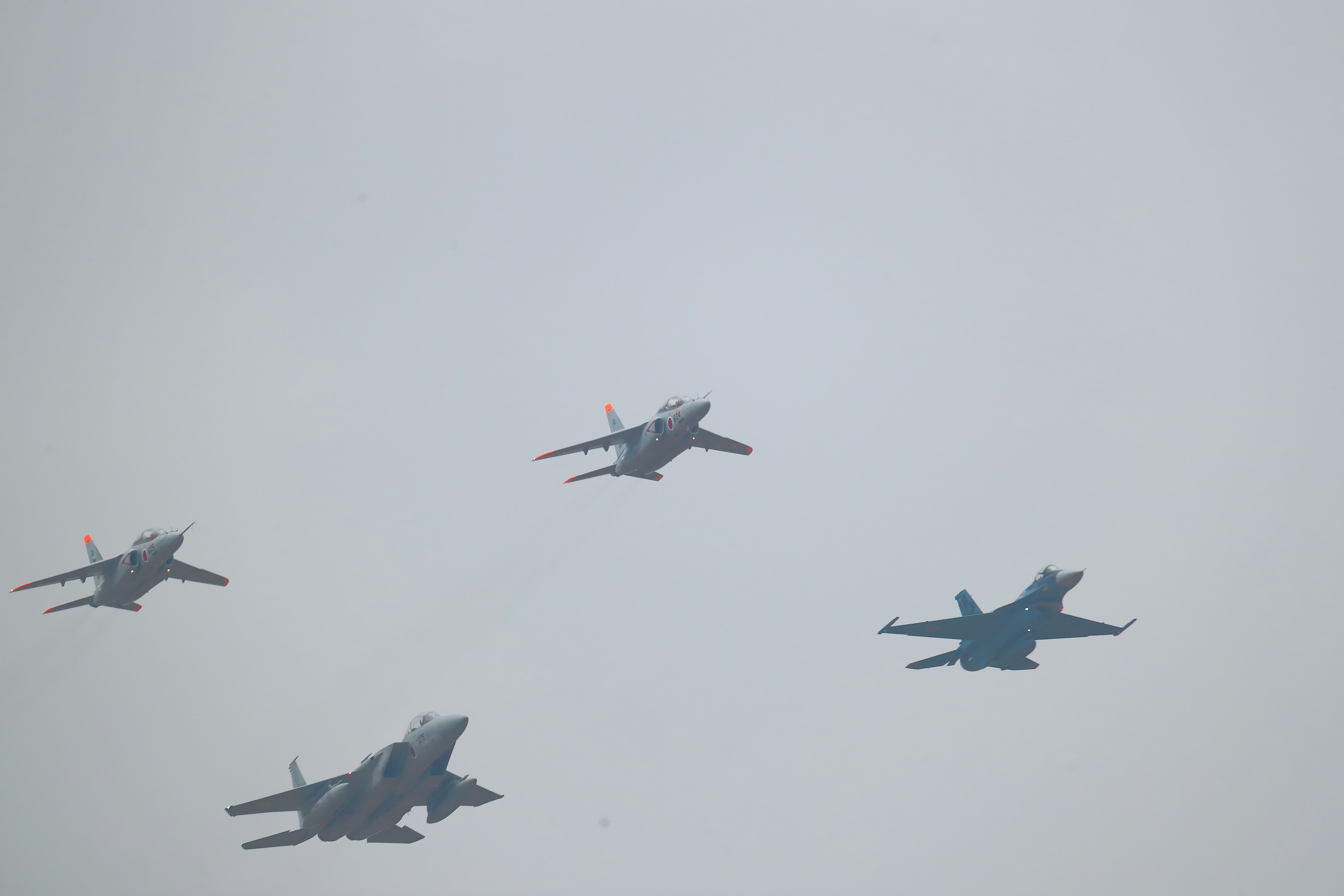 Formation flight of multiple fighter jets in the sky