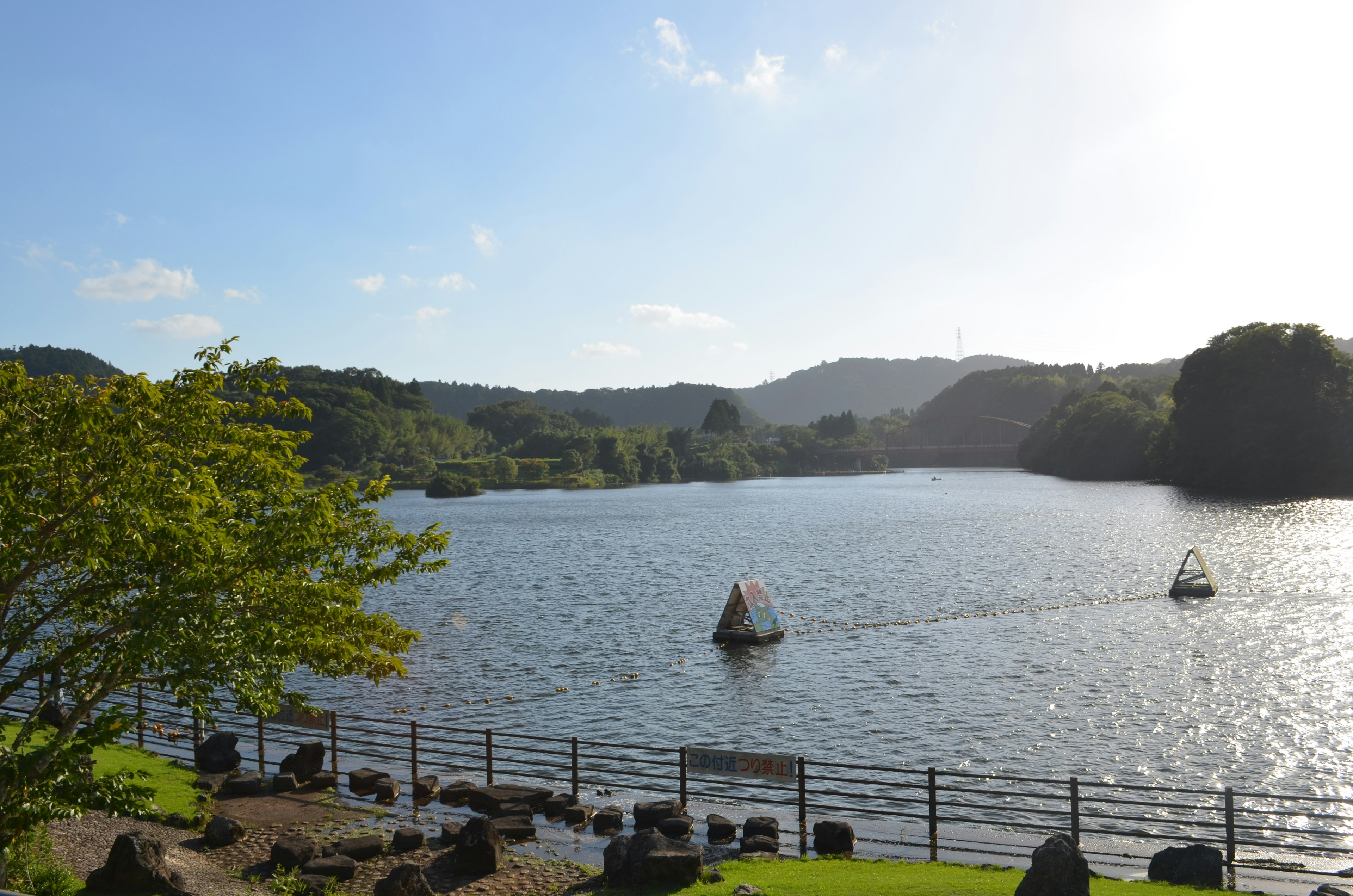 Serene lake with small boats floating