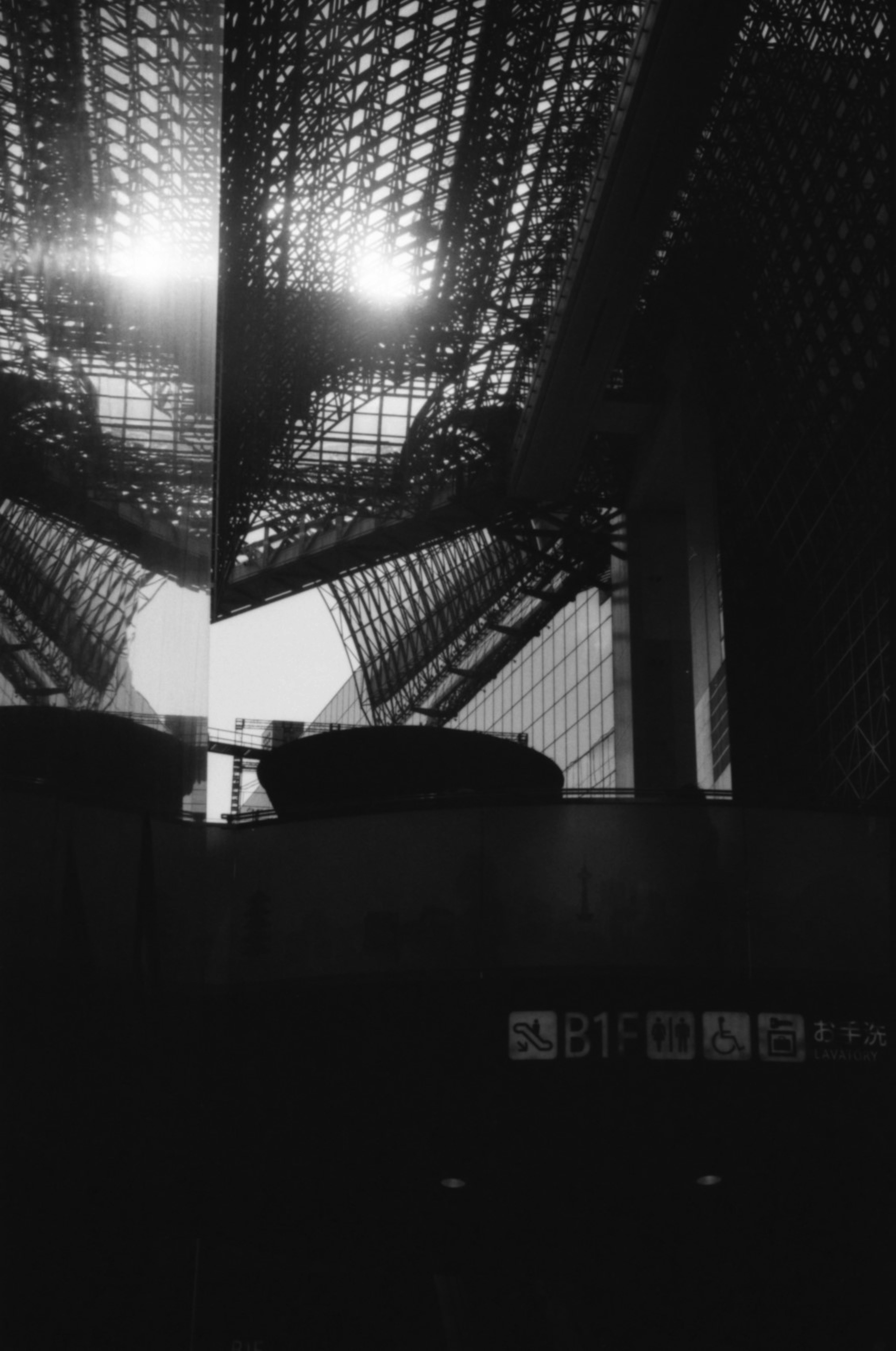 Contrast of light and shadow seen from inside a black and white structure