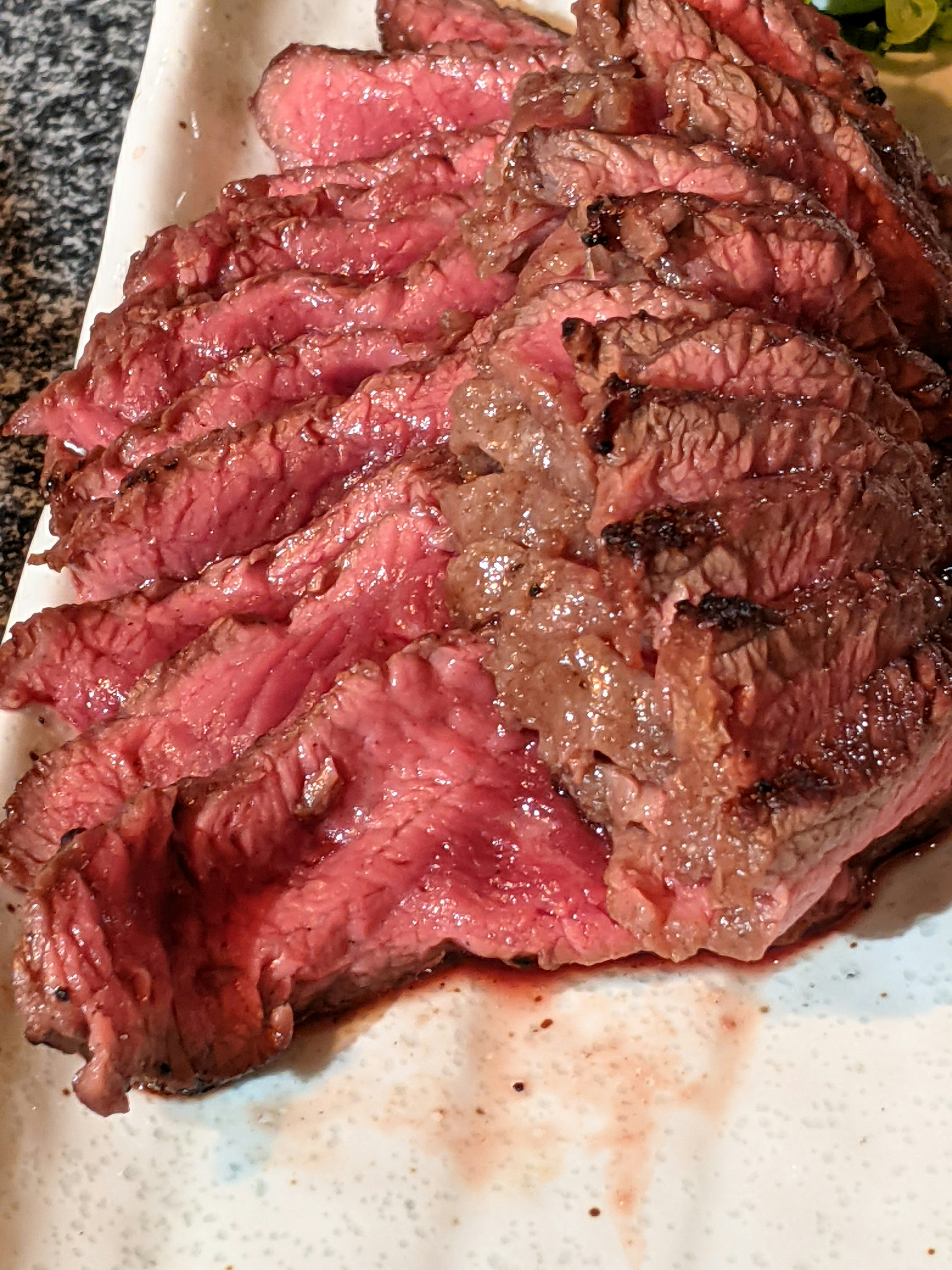 Sliced steak with perfect doneness served on a plate