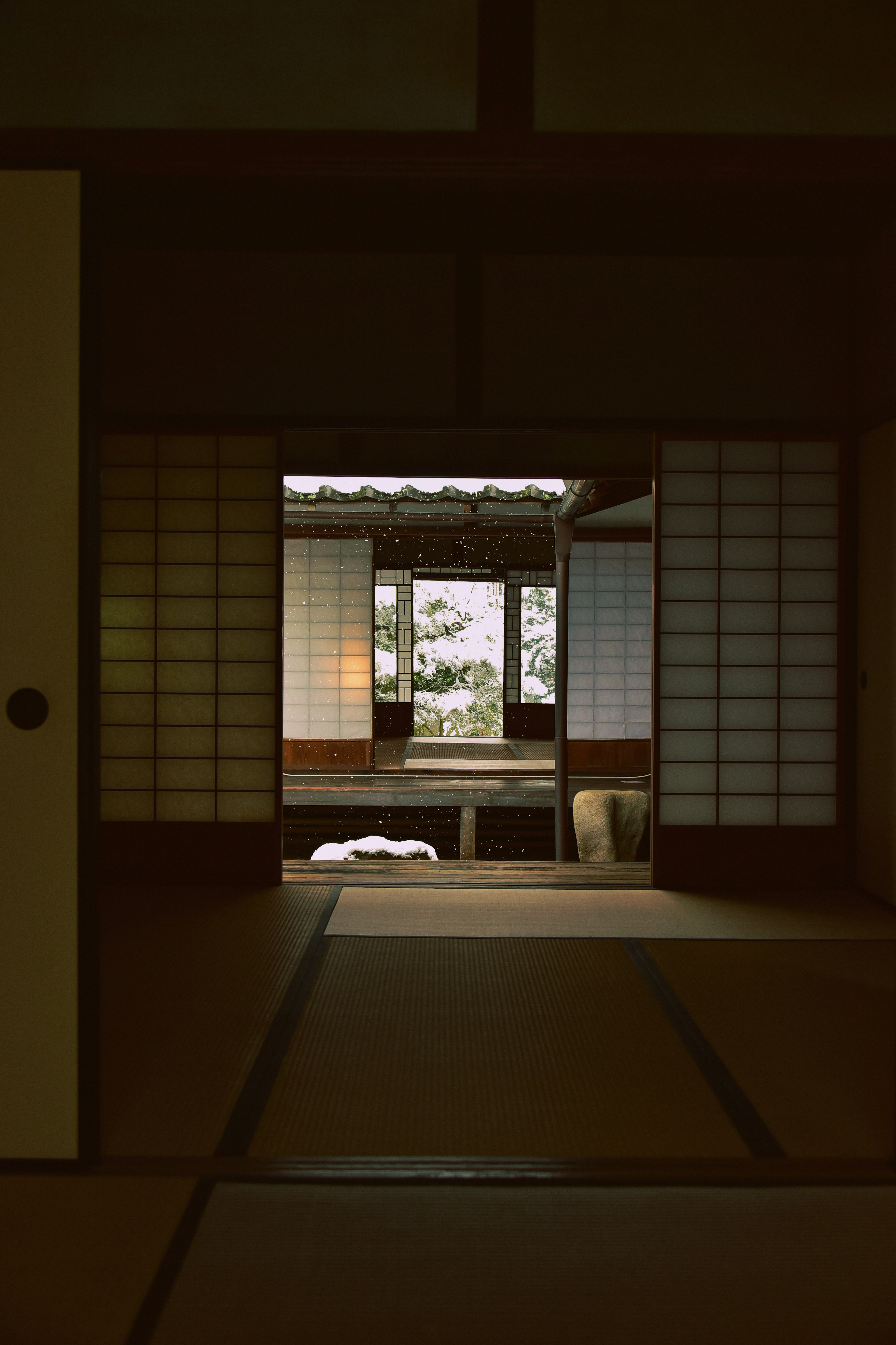 Entrance to a traditional Japanese room with shoji doors and a serene view