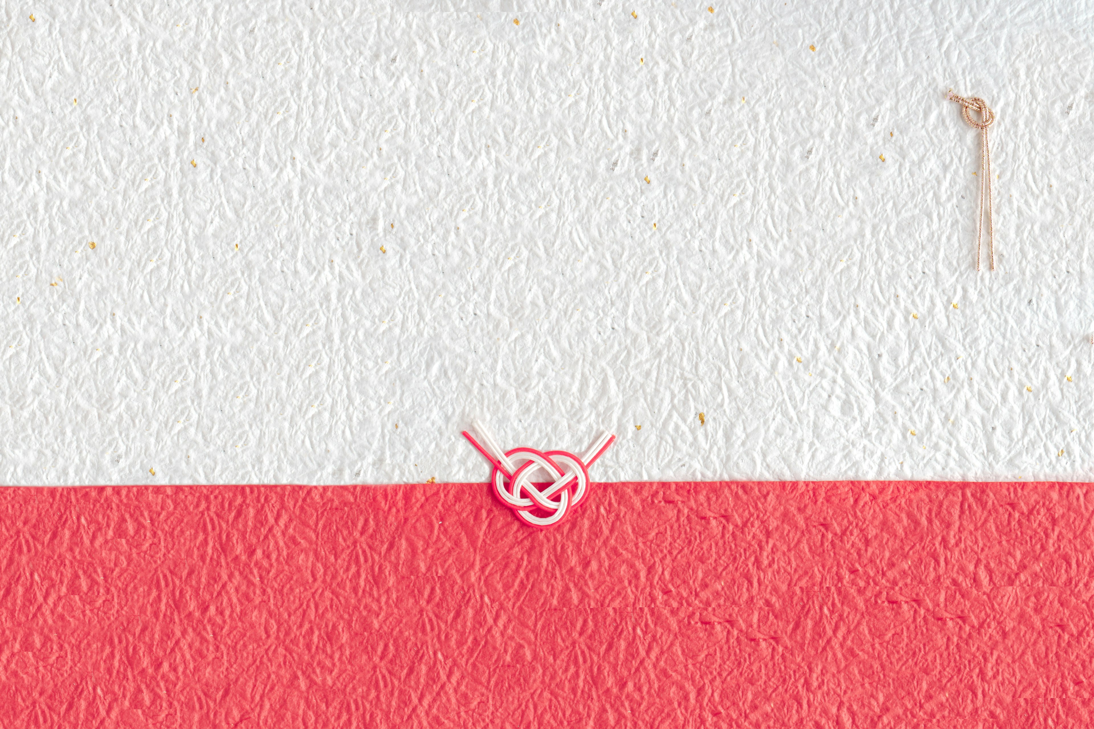 A white and red background featuring a knot design