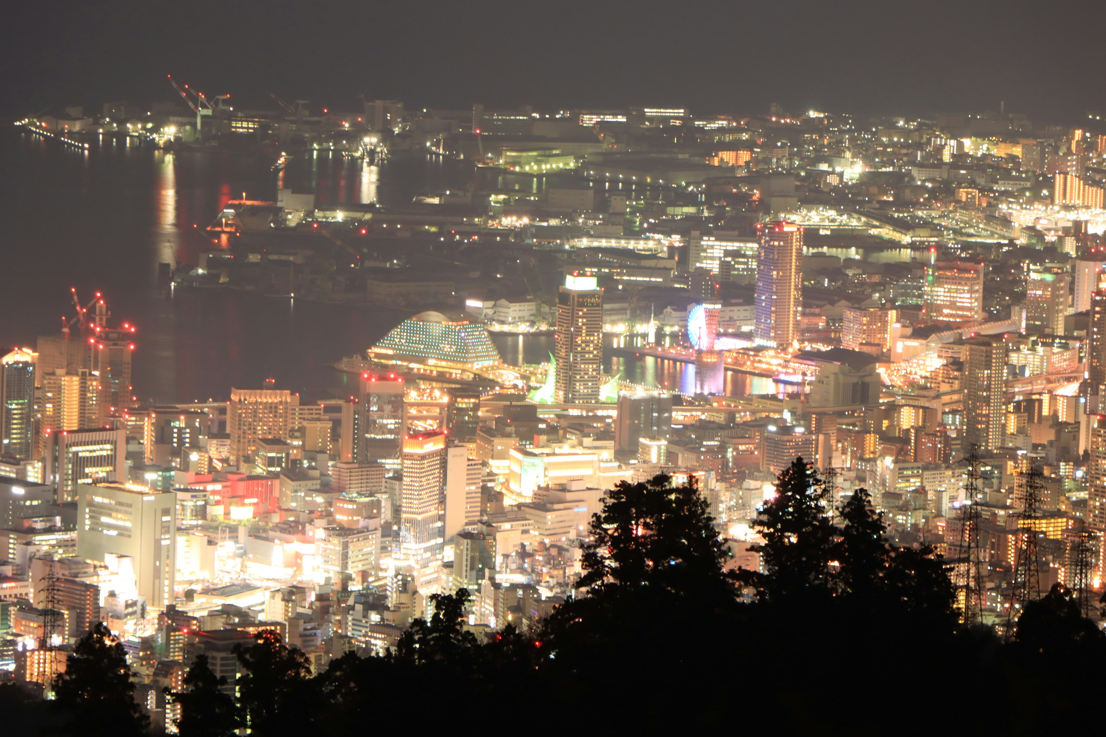 Night cityscape with bright streetlights and illuminated buildings