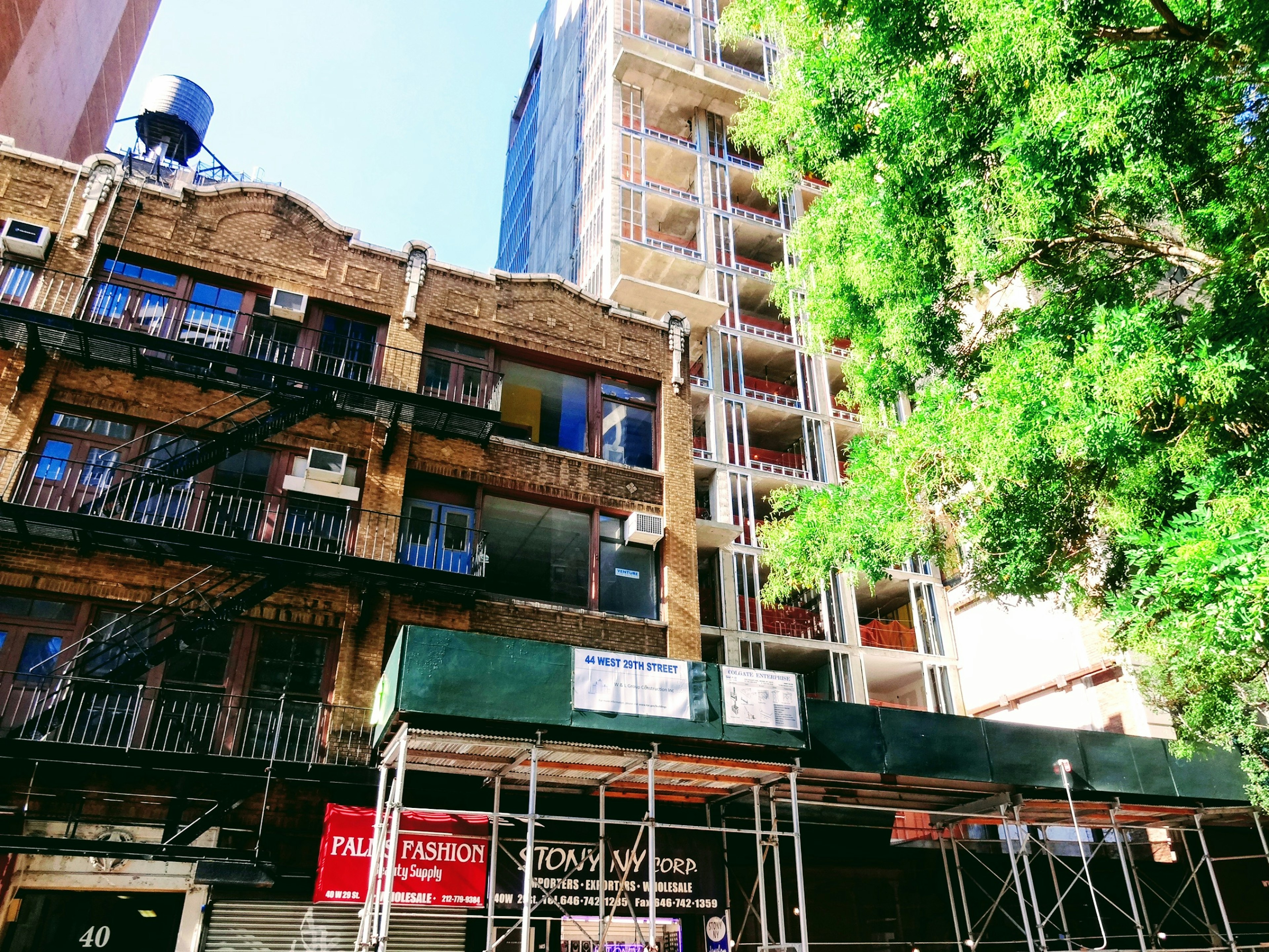 Urban landscape featuring an old building next to a modern high-rise