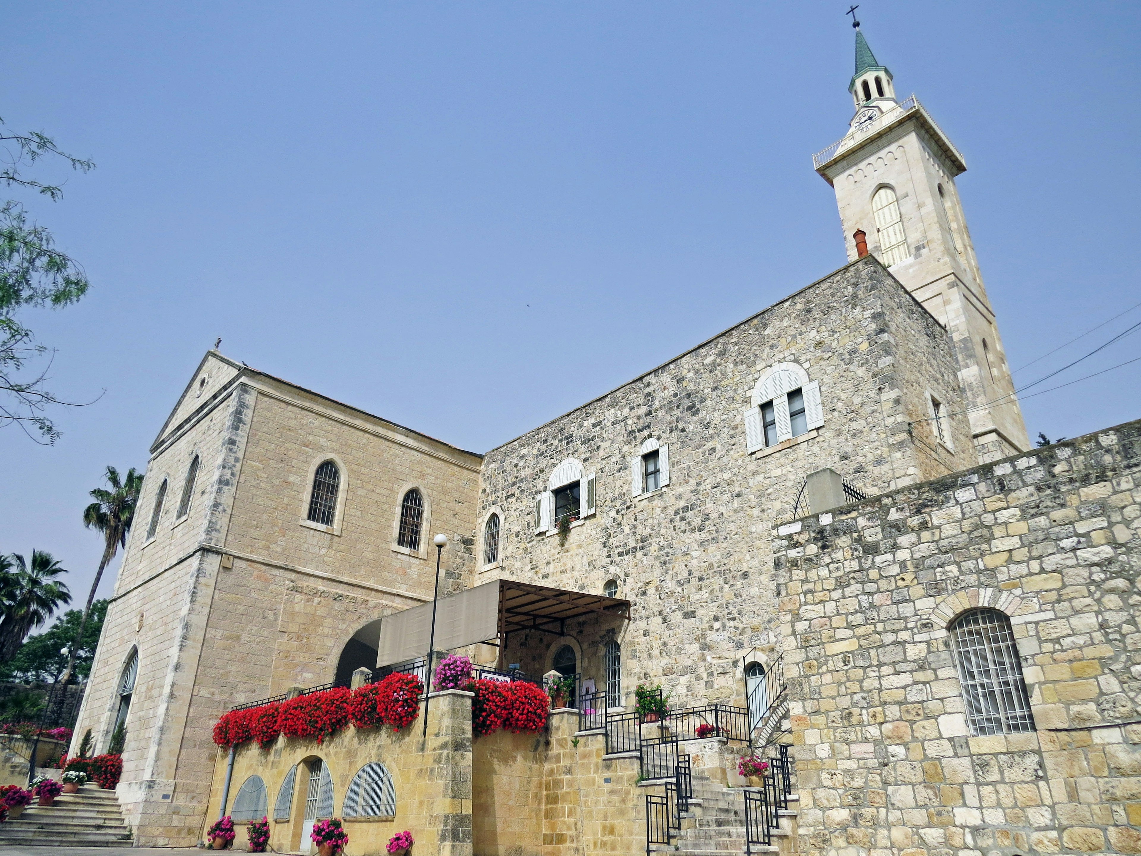 Beautiful stone church standing under a blue sky