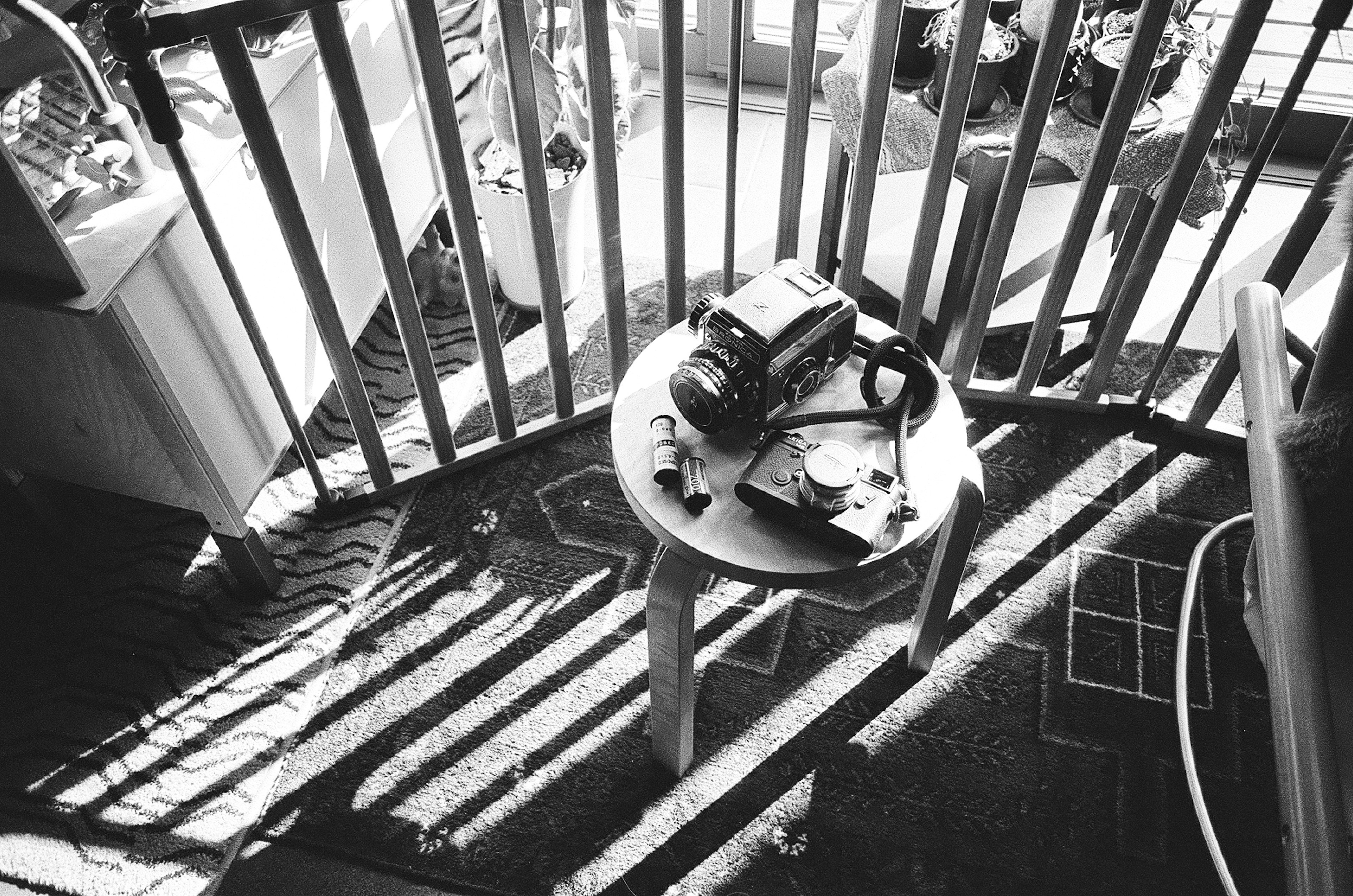 A balcony scene with a camera and items on a table