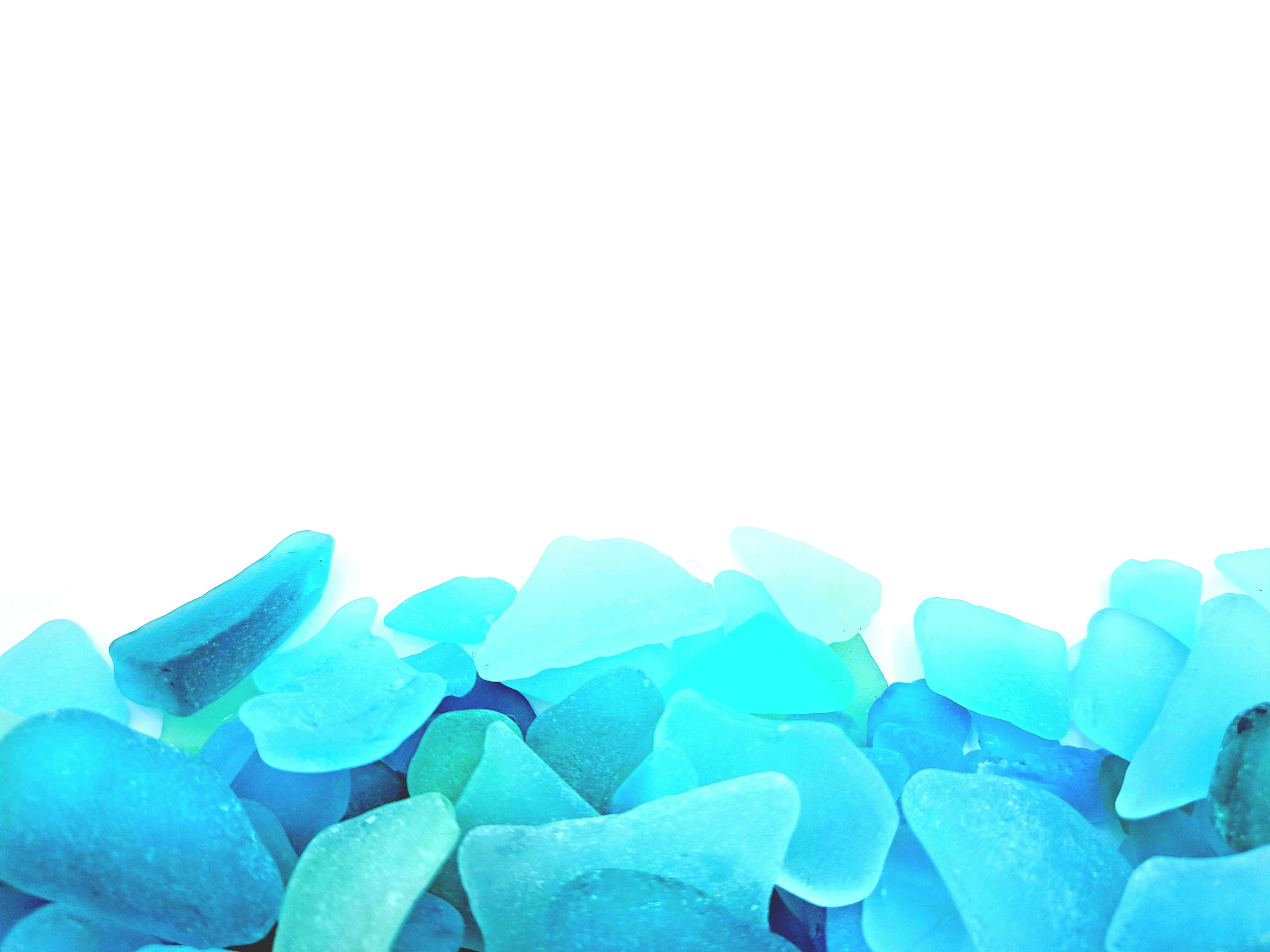 A pile of blue sea glass pieces arranged artistically