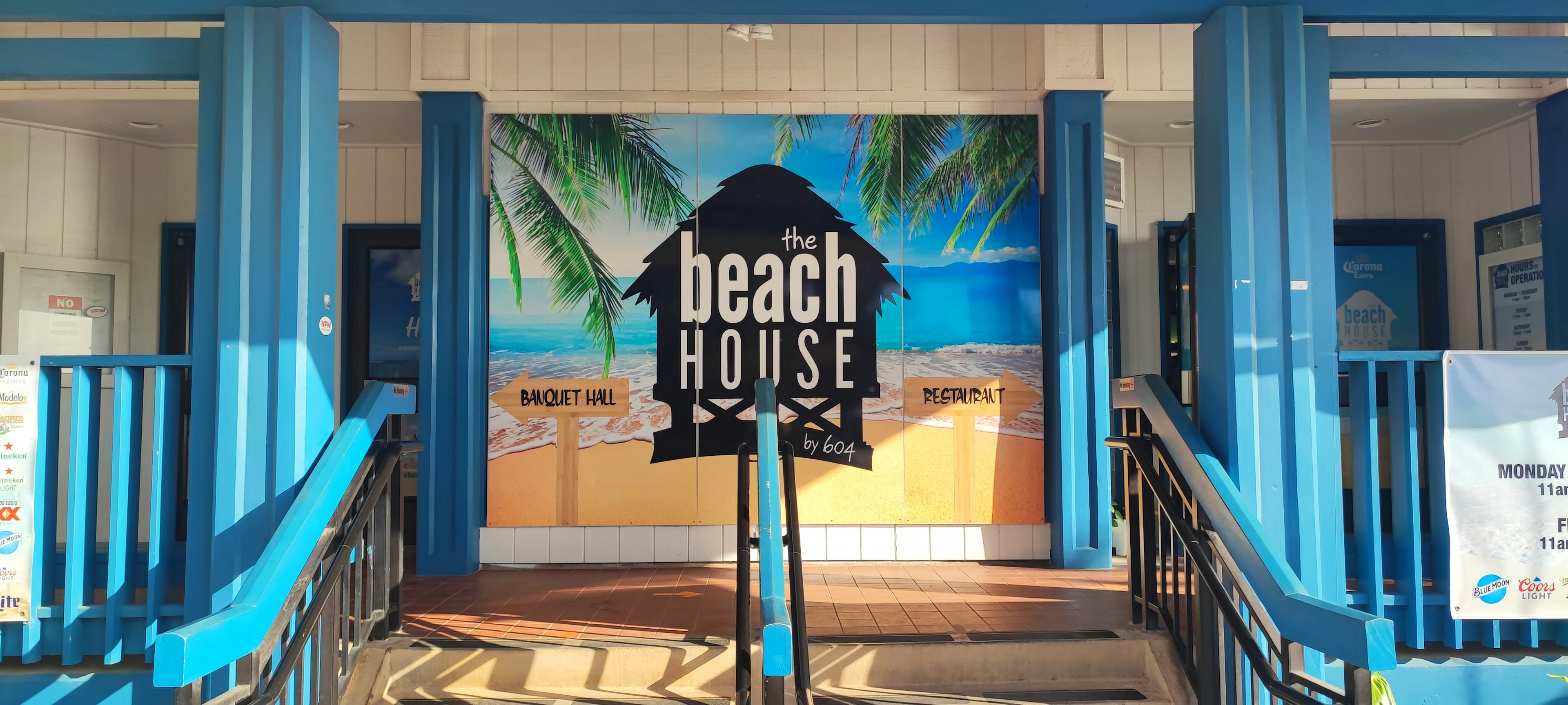 Entrance with beach house sign and blue decor