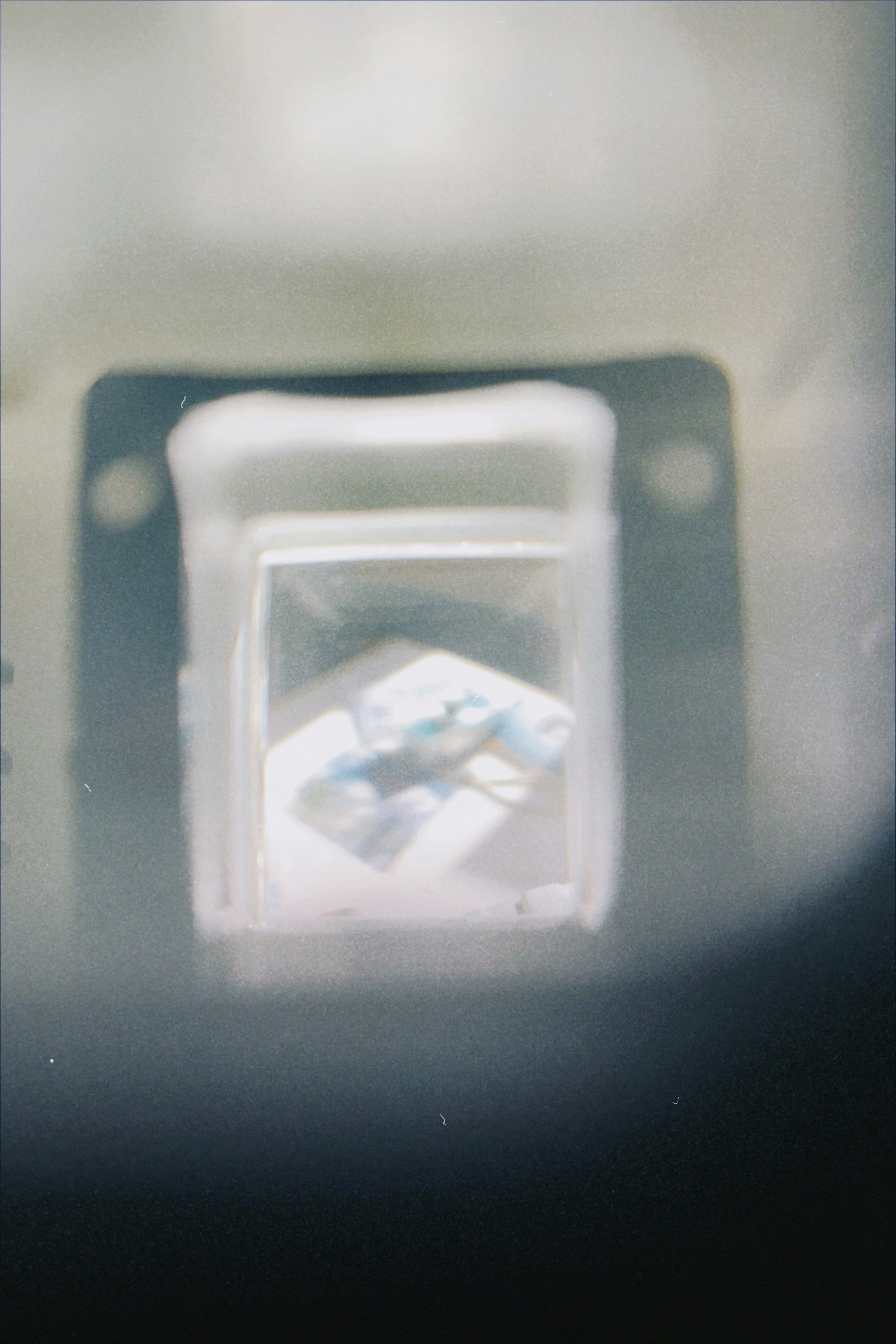 Image of a transparent cube with blue patterns inside