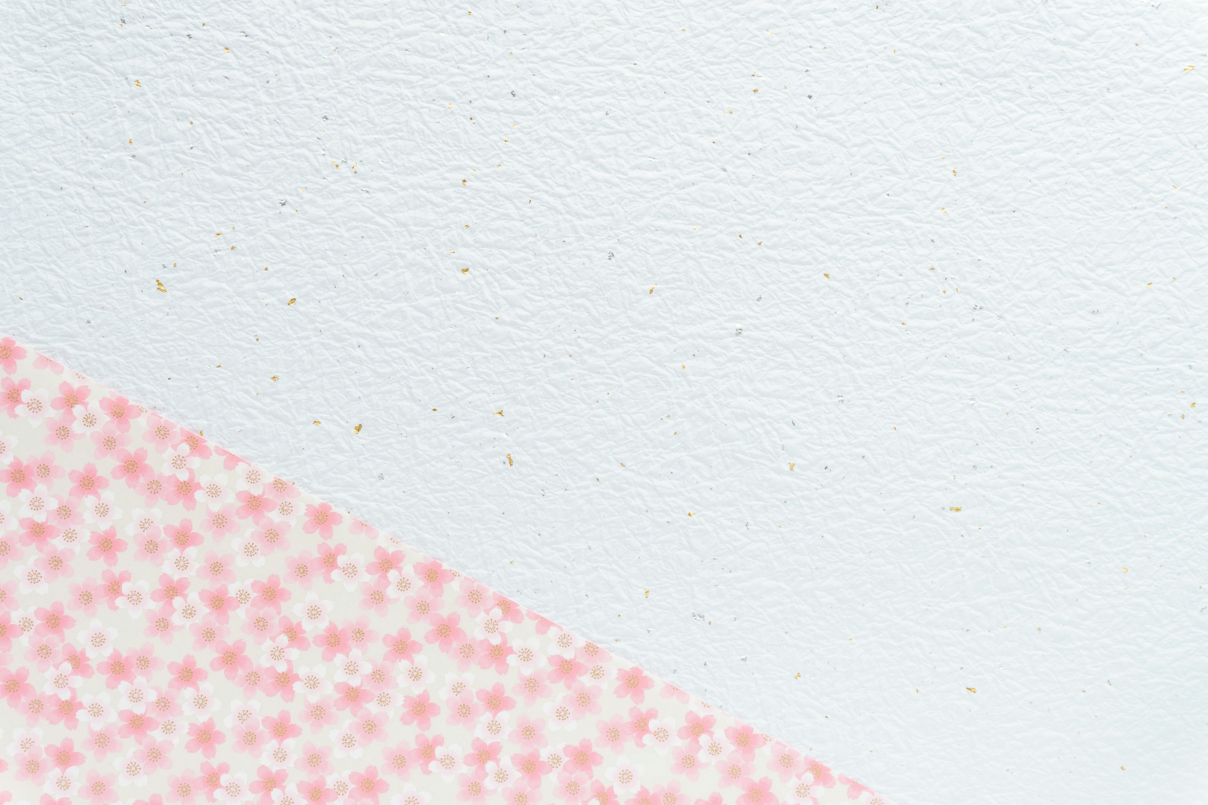 Design featuring pink floral patterns on a white background