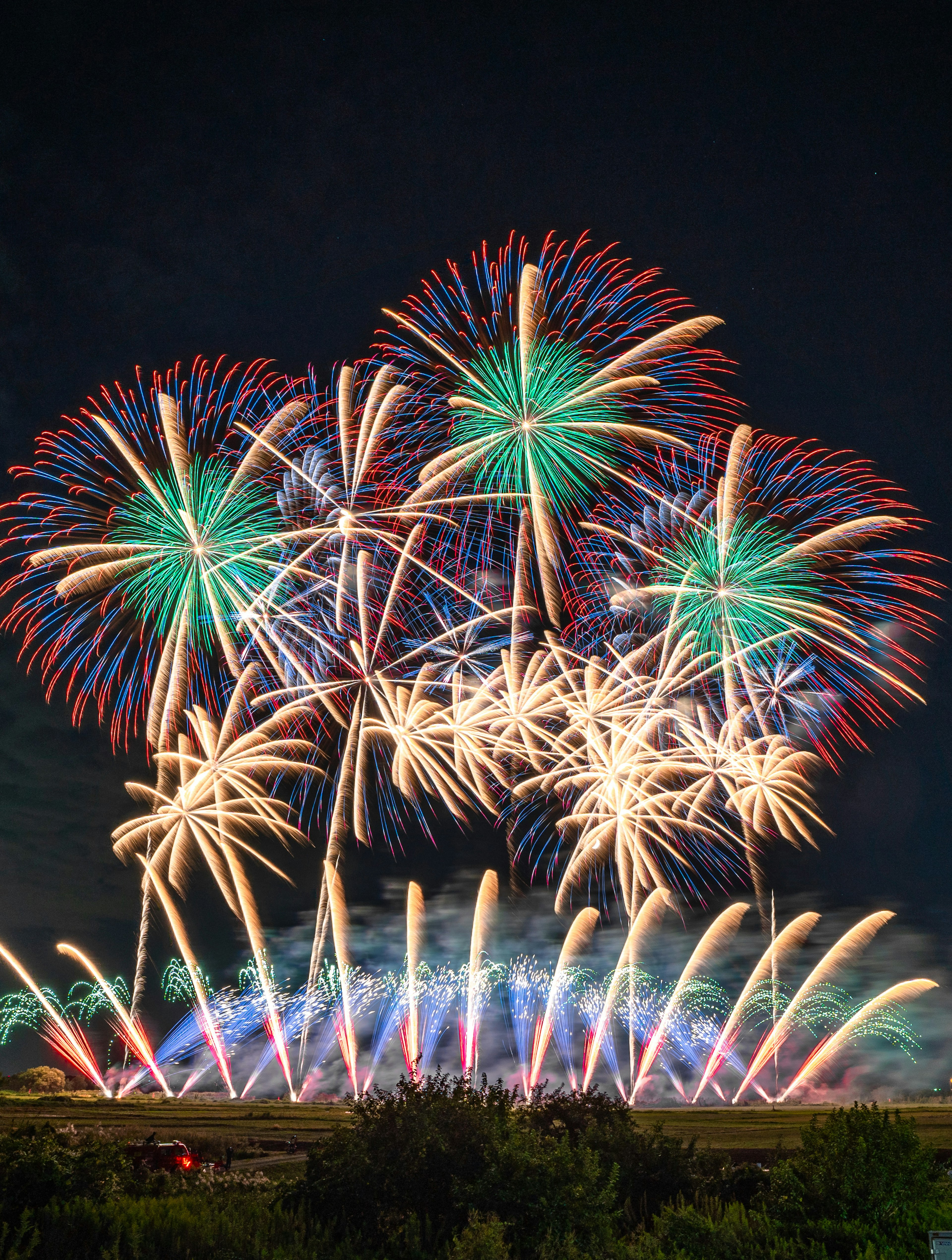 Colorful fireworks bursting in the night sky with beautiful radial patterns