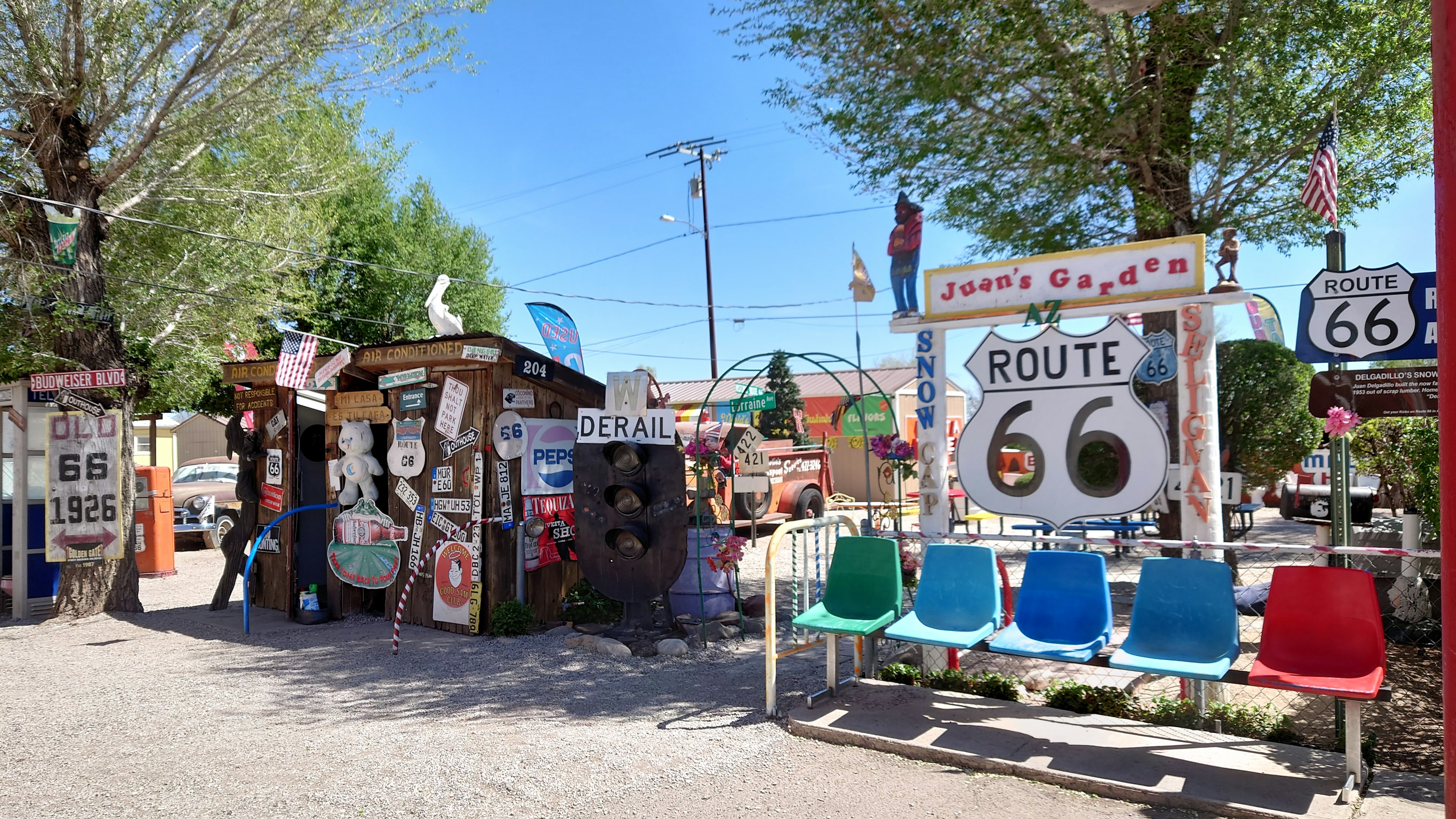 Colorful seating and shops featuring Route 66 signs