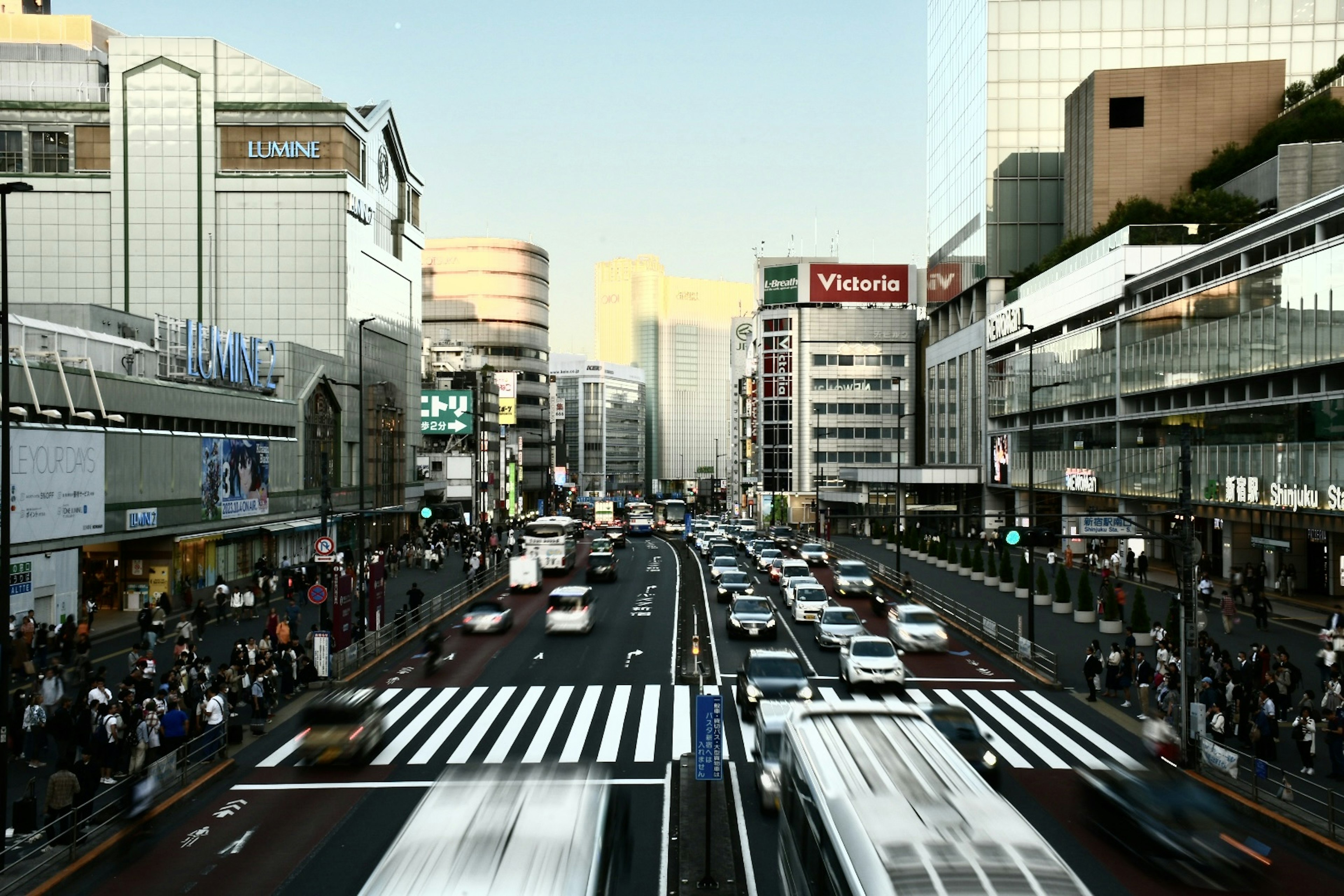 Busy urban intersection with crowds and vehicles