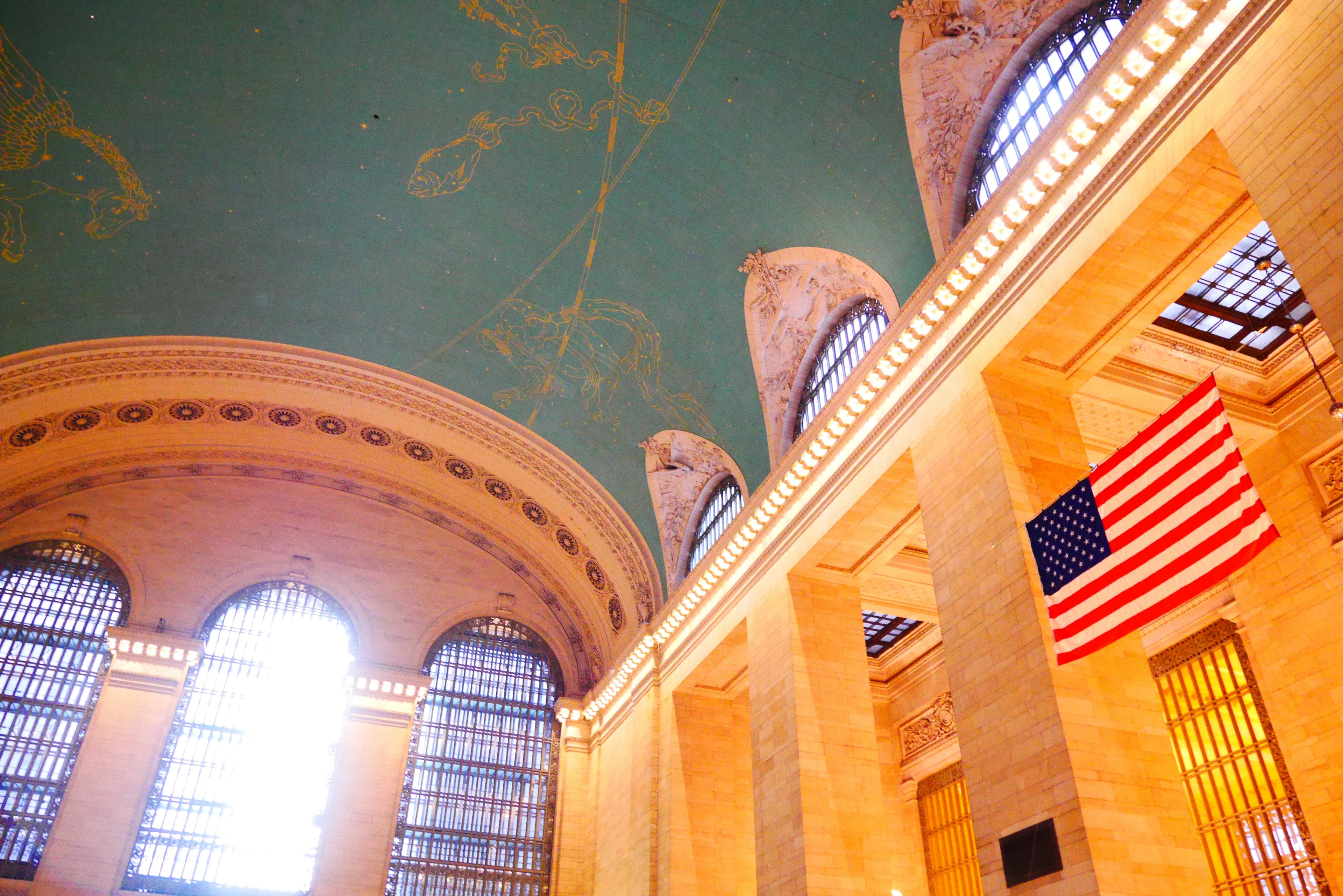 Grand Central Station featuring stunning ceiling and American flag