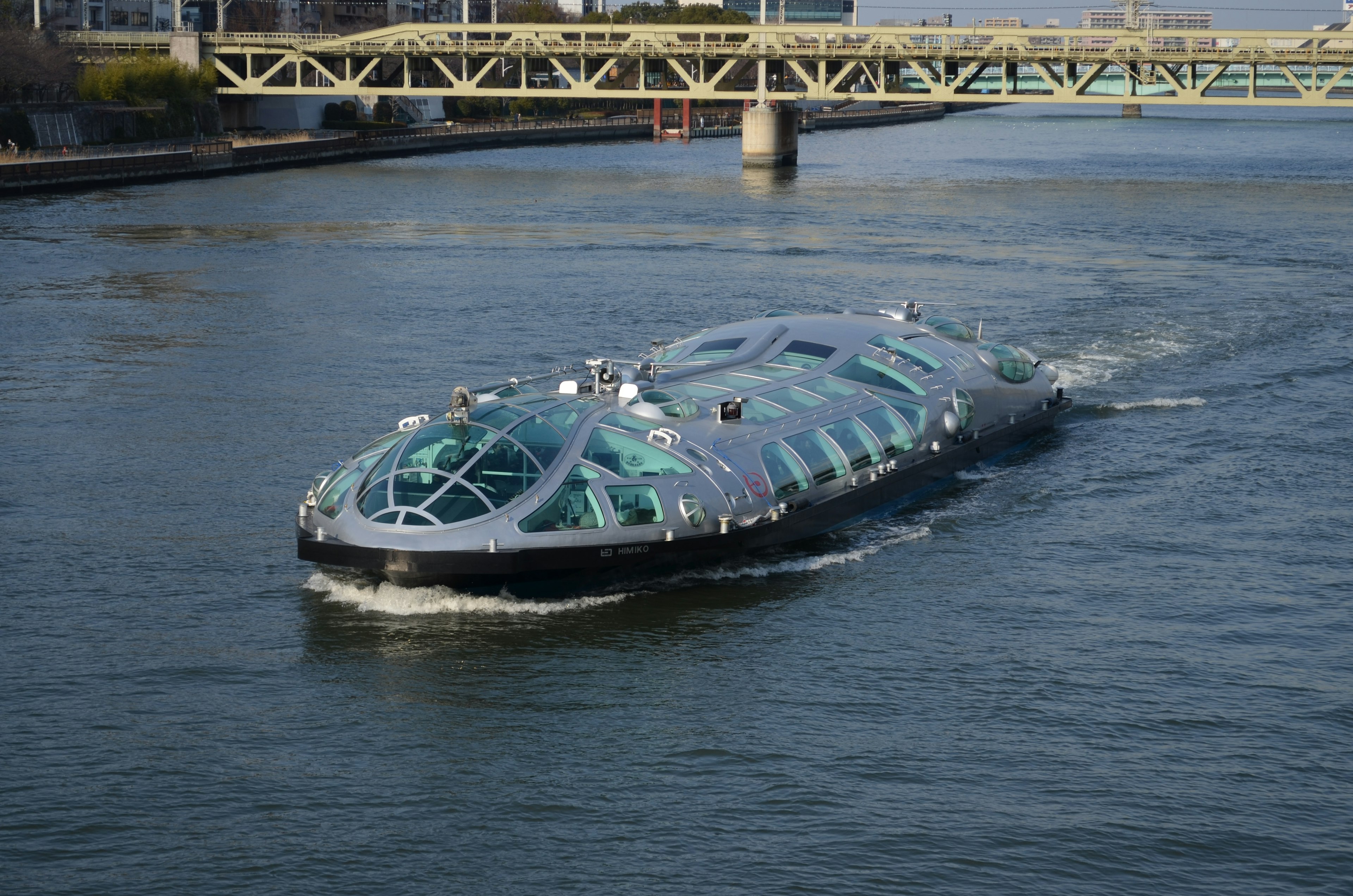 A futuristic boat gliding on the water in a river