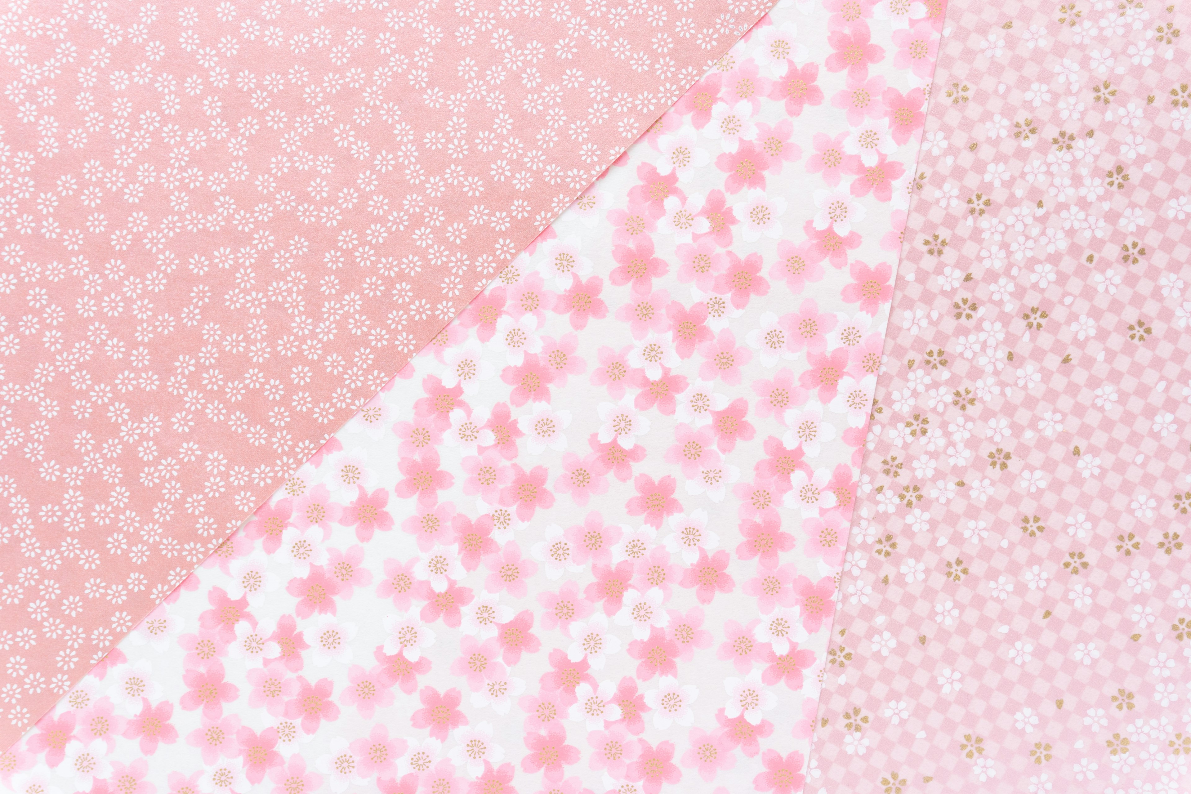 Textured patterns in soft pink tones featuring floral designs