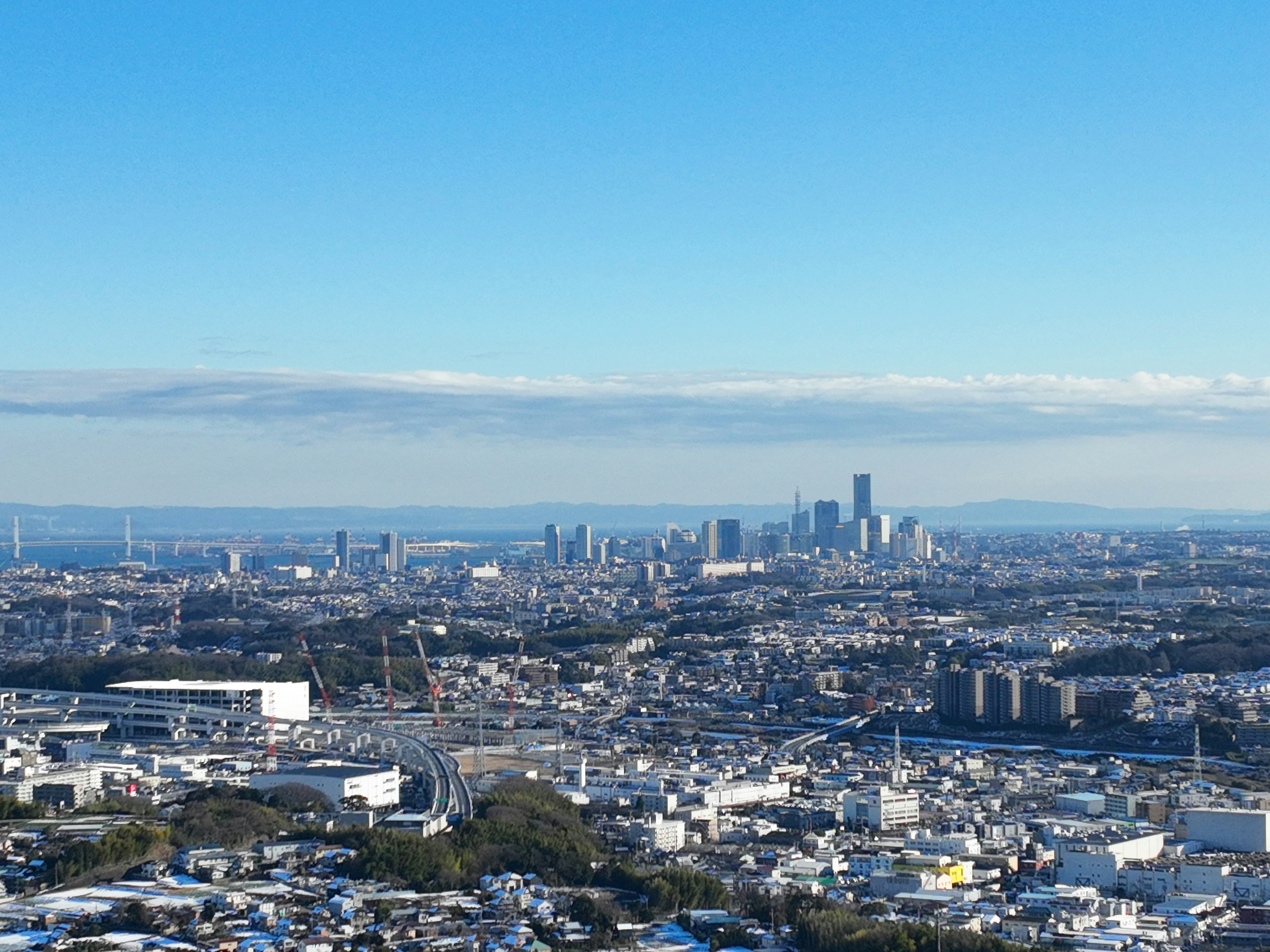 Panoramic view of a cityscape under a clear blue sky