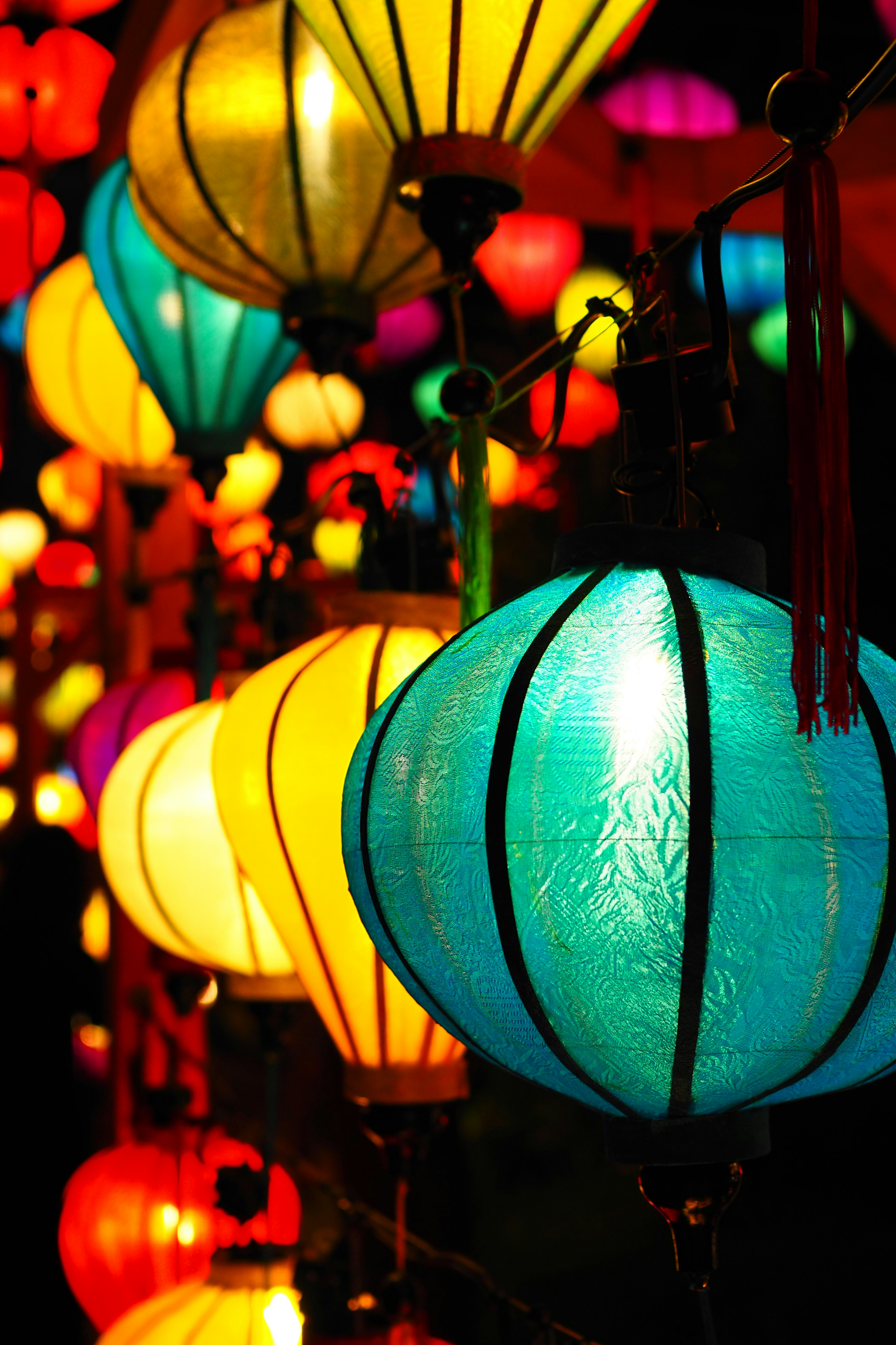 Colorful lanterns hanging in a vibrant night scene