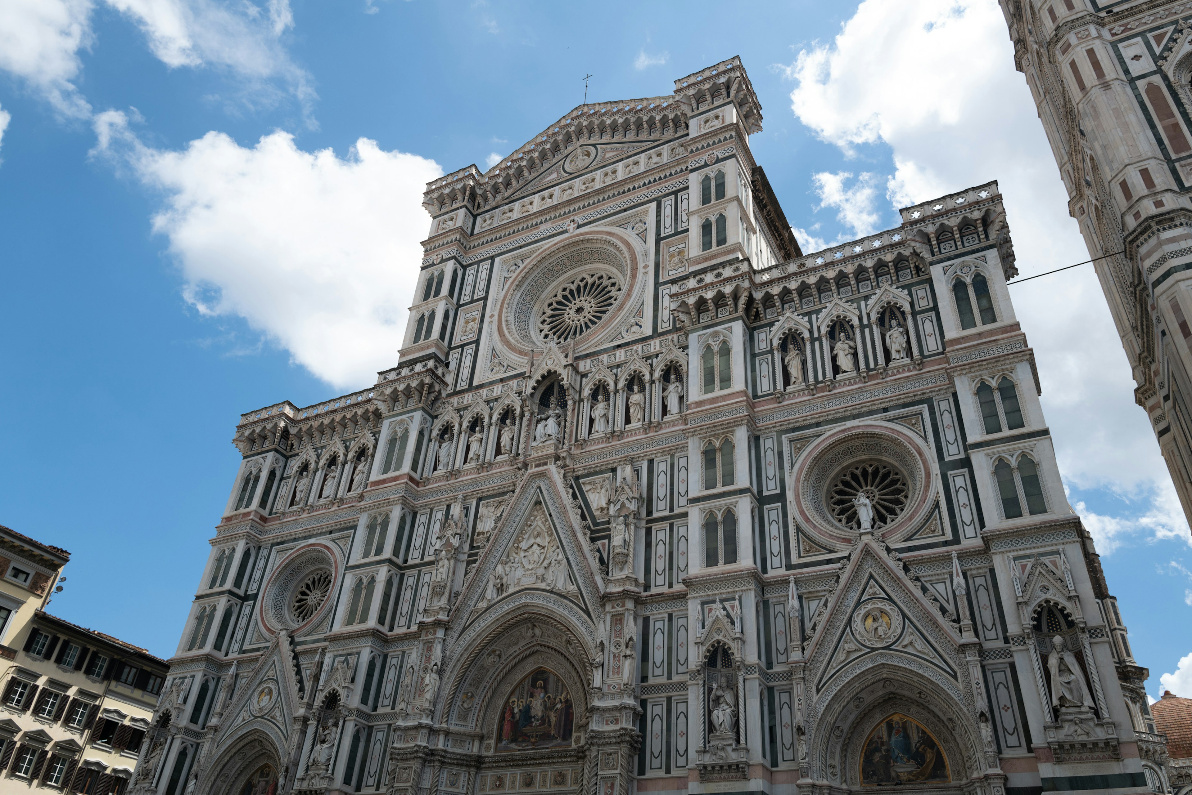 Magnificent facade of Florence Cathedral against a blue sky