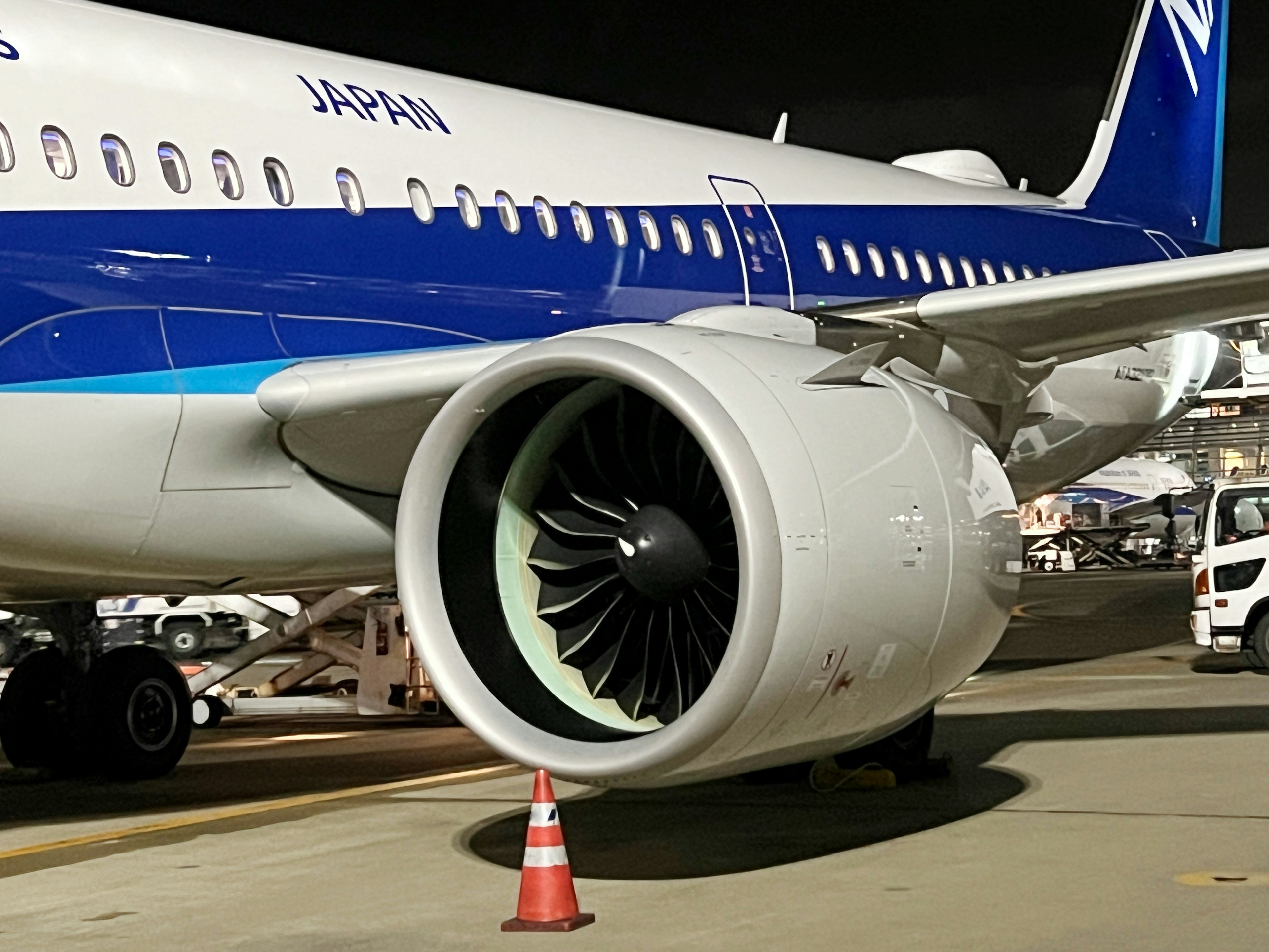 Airplane engine and body of a Japanese aircraft at night