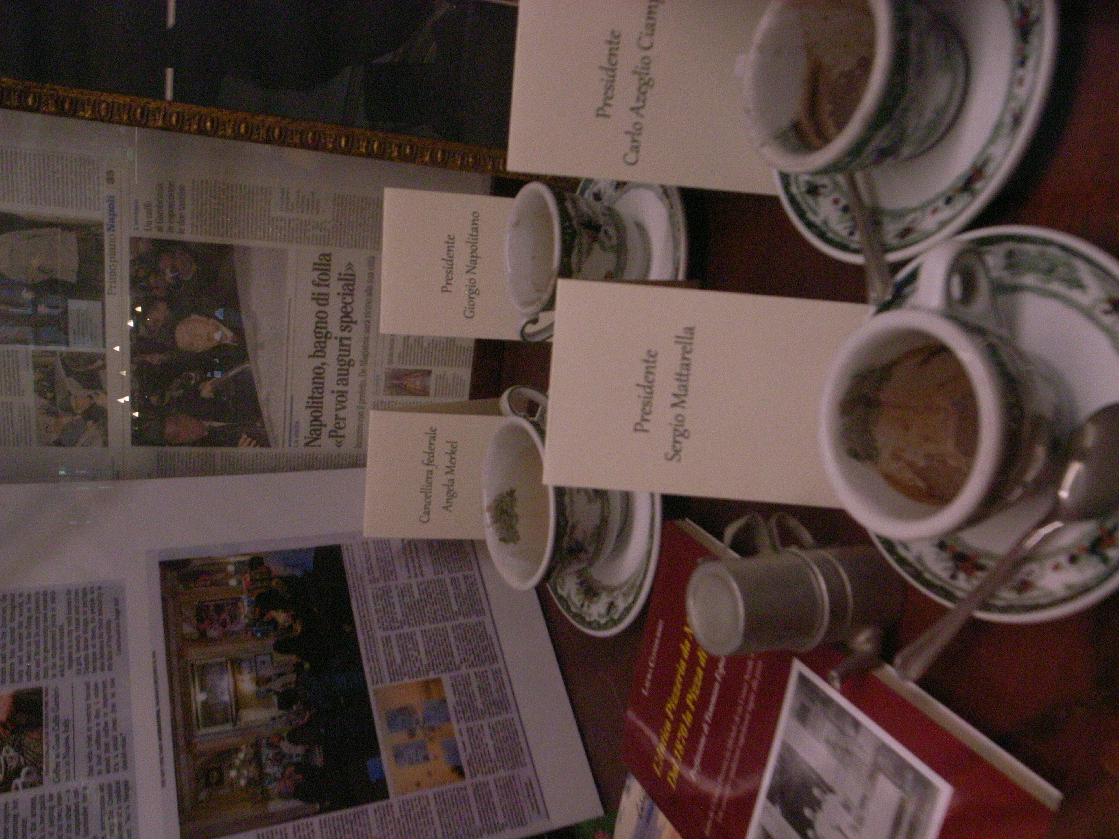 A table setting with coffee cups and menu cards arranged neatly