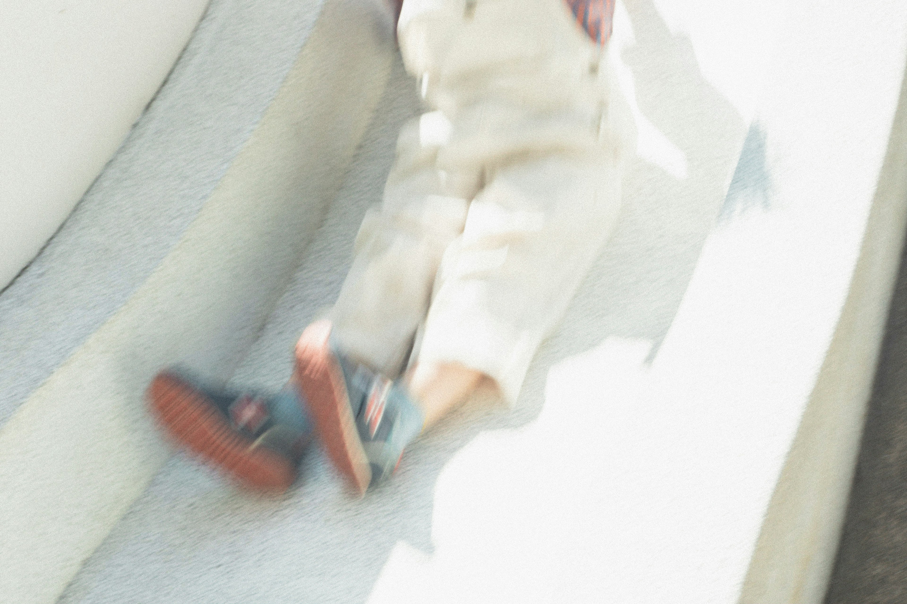 Child's feet sliding down a slide