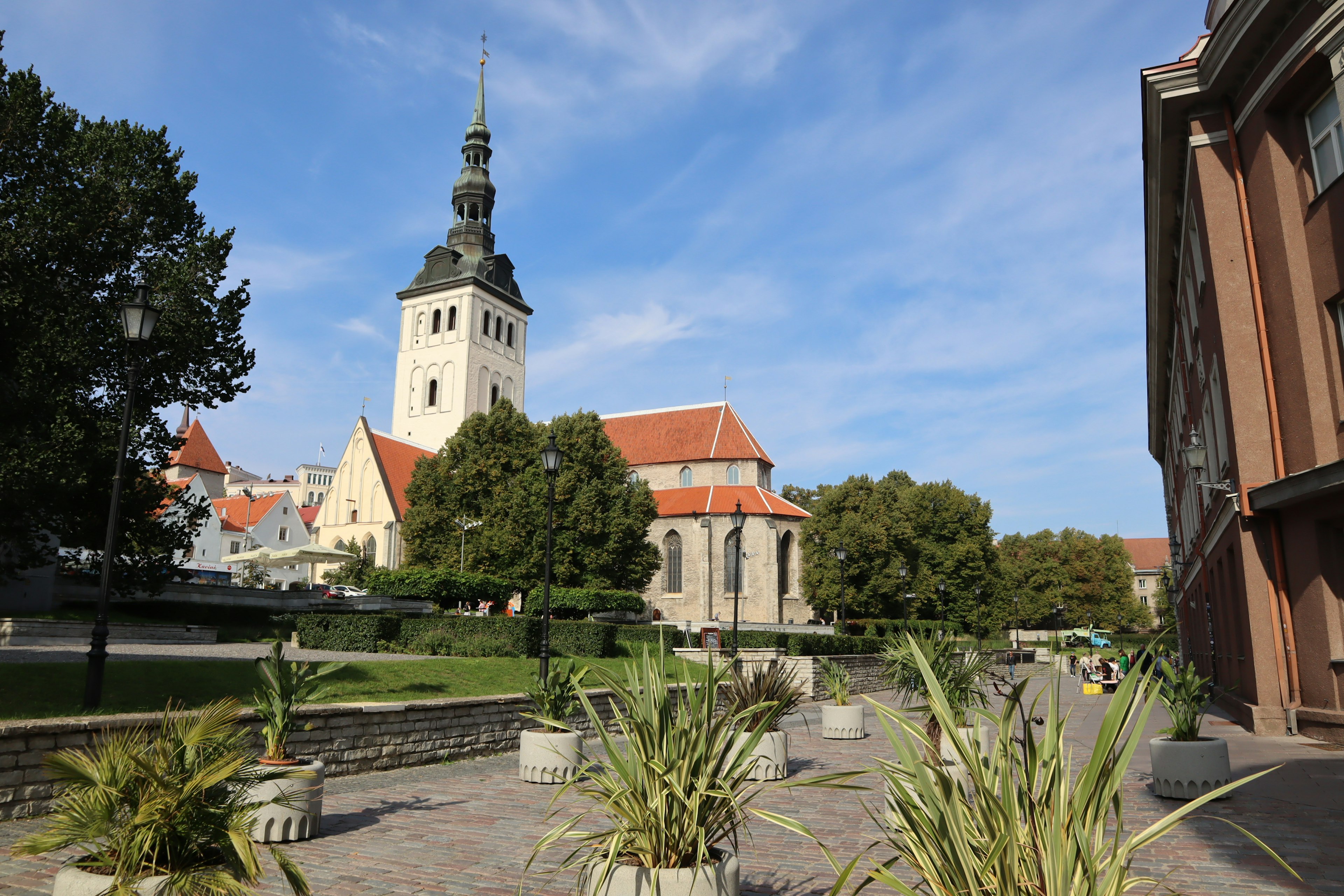 Church tower in a scenic landscape with lush greenery