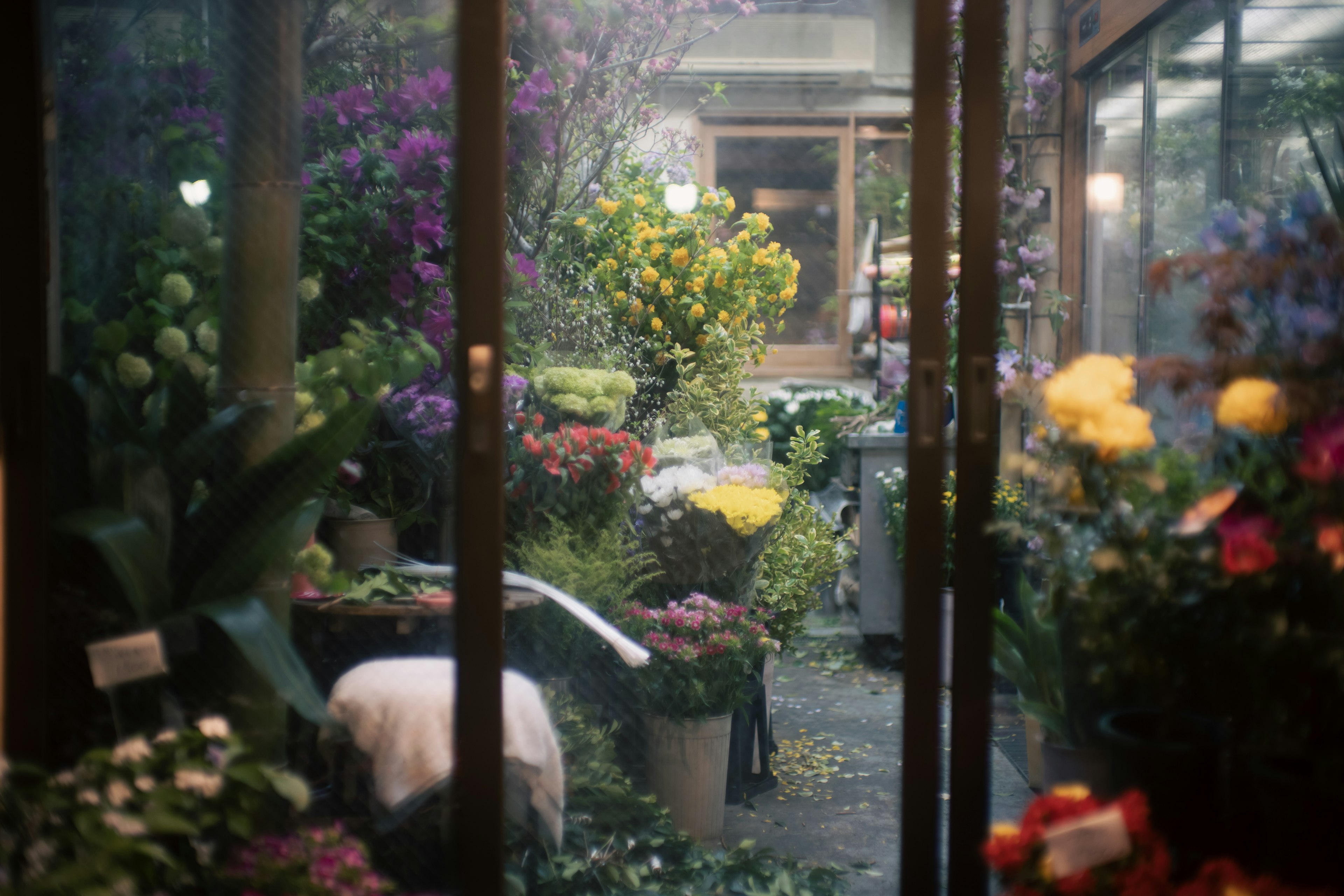 Interior view of a flower shop filled with colorful flowers