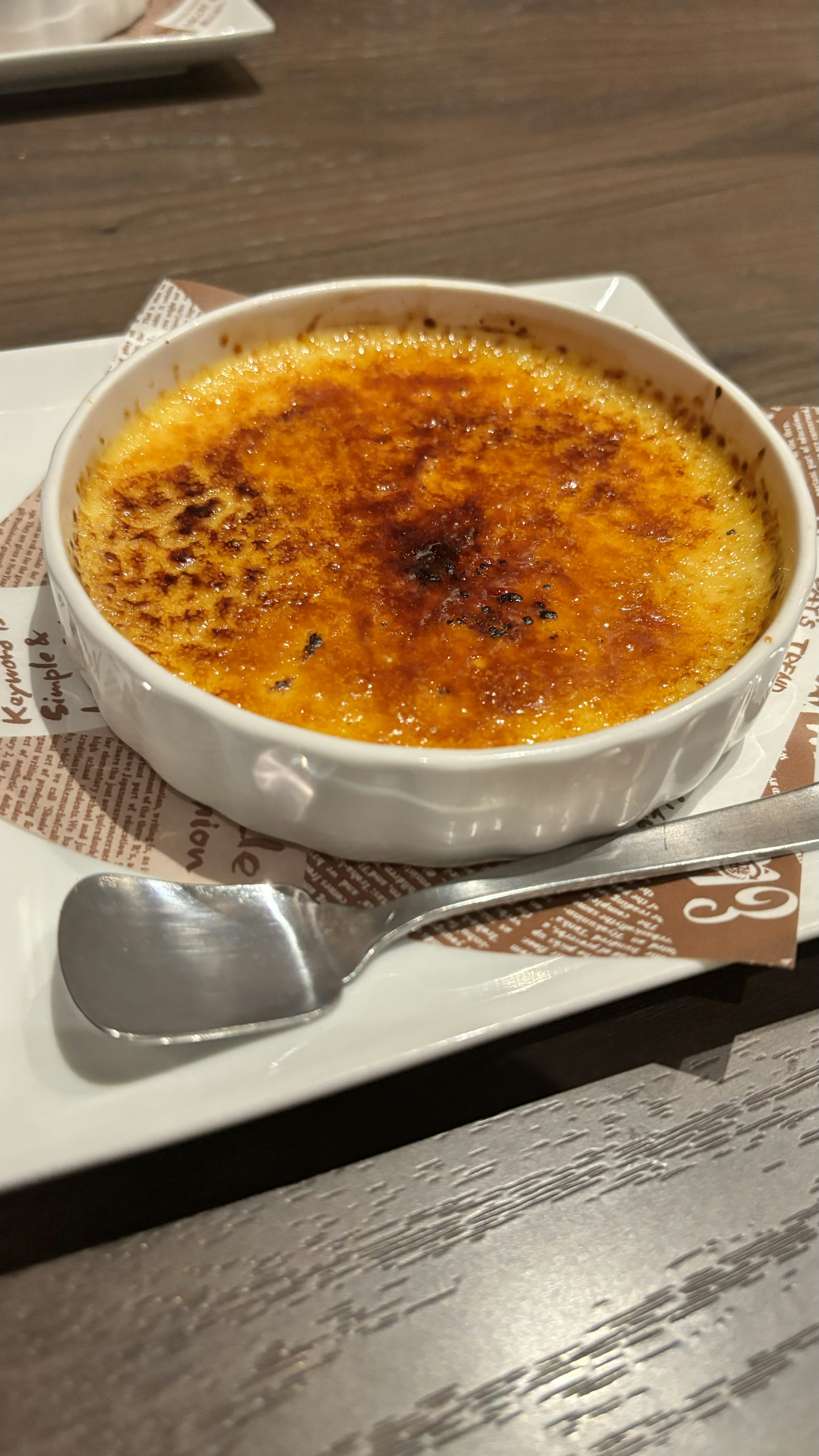 Creme brulee served in a white dish