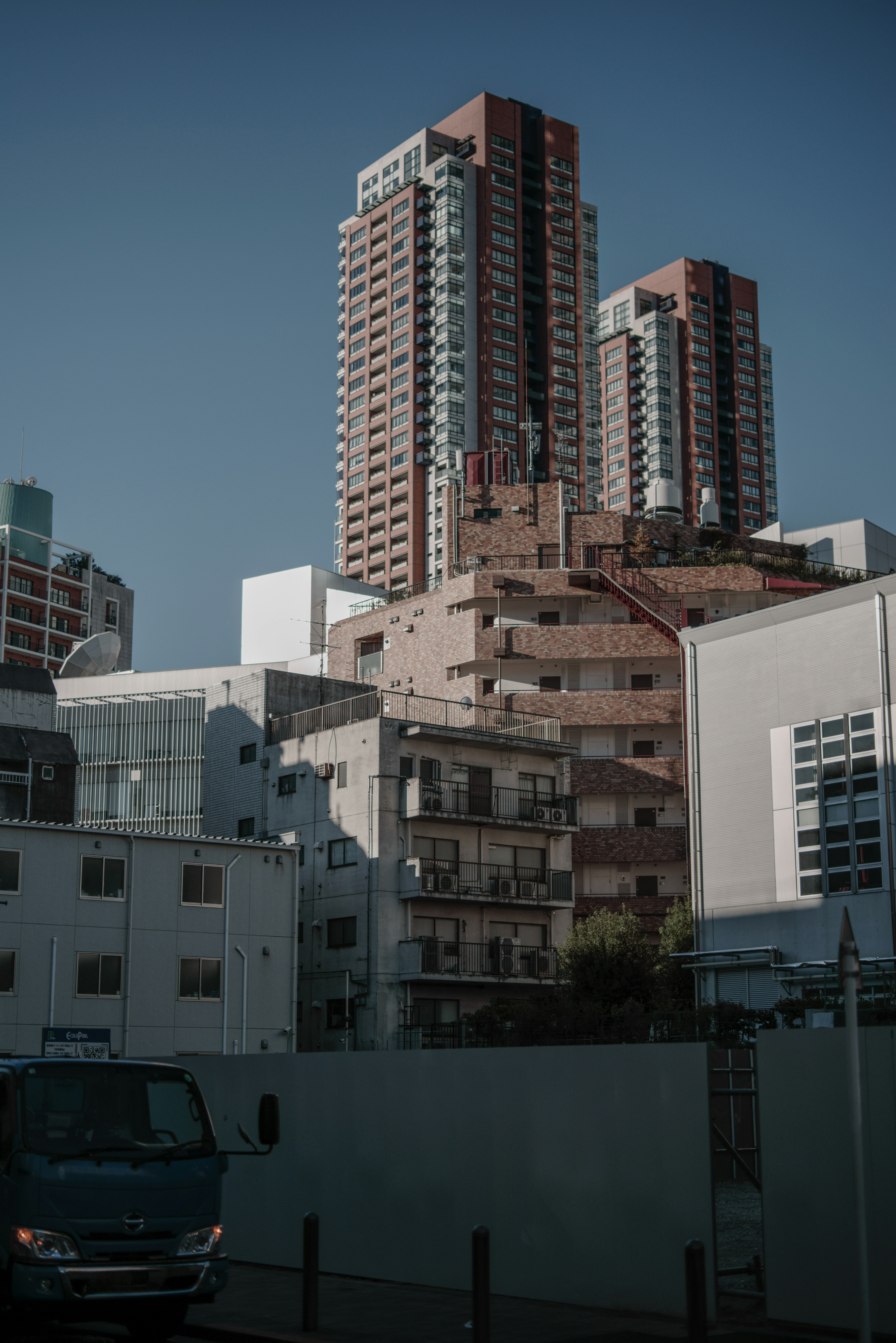 Urban landscape featuring contrasting skyscrapers and low-rise buildings