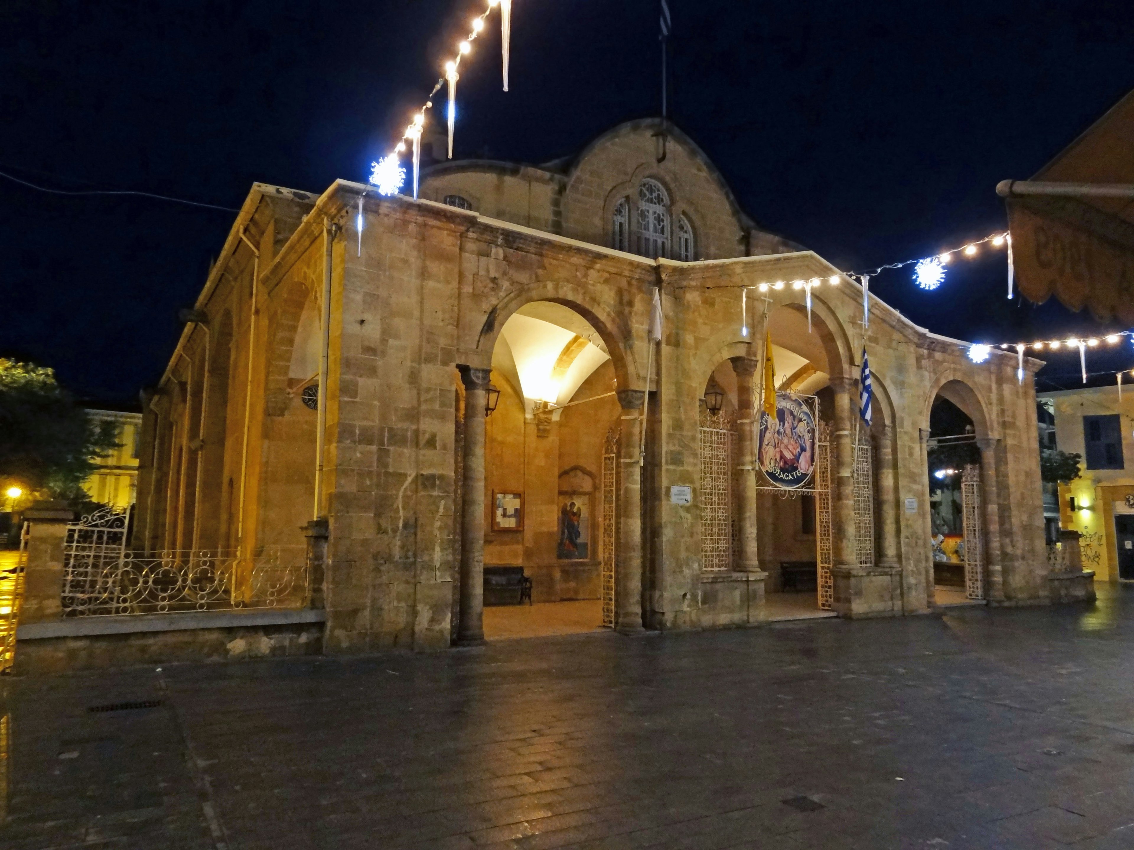 Historic building in the city at night with beautiful arched windows and warm lighting