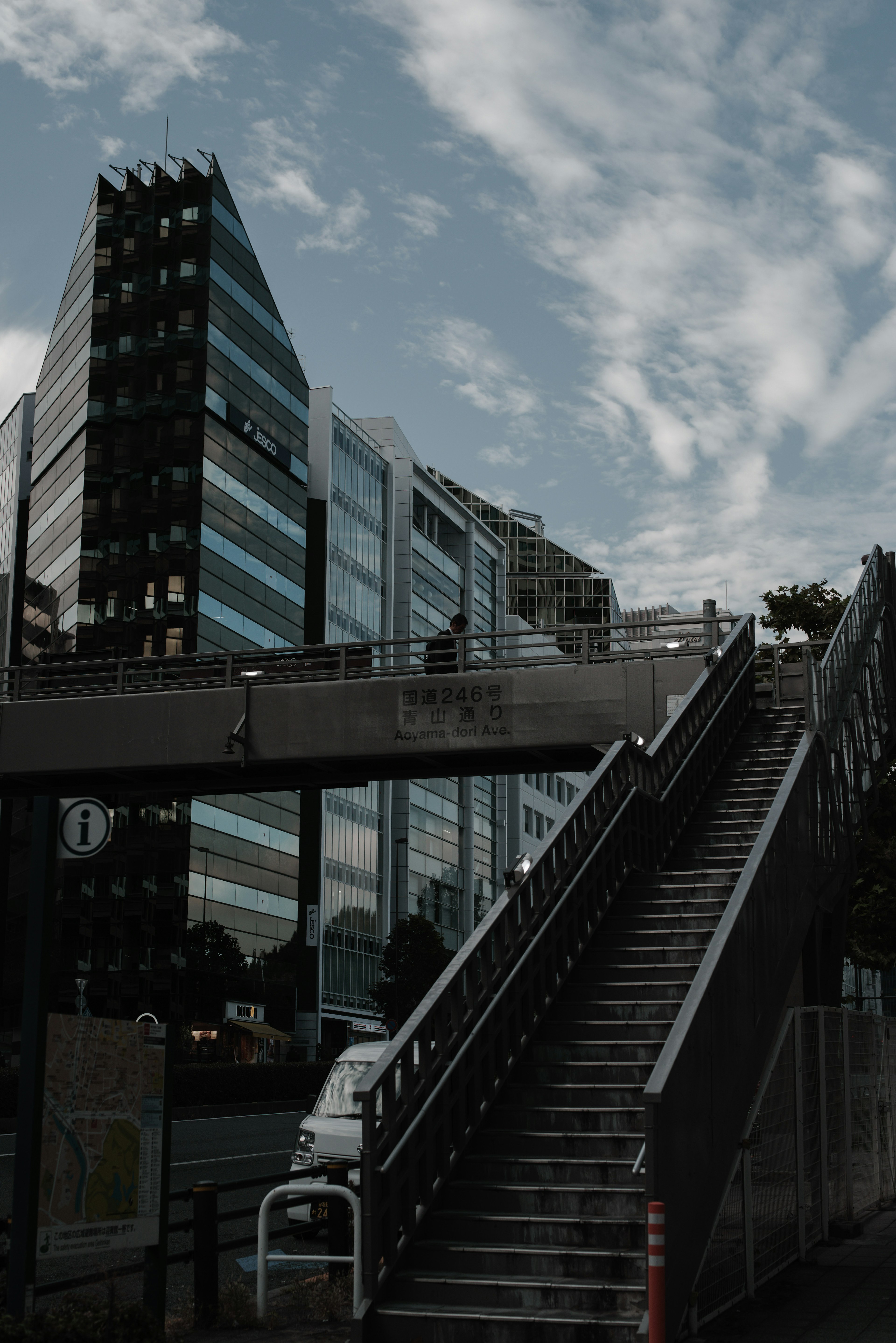 Modern buildings with stairs under a cloudy sky