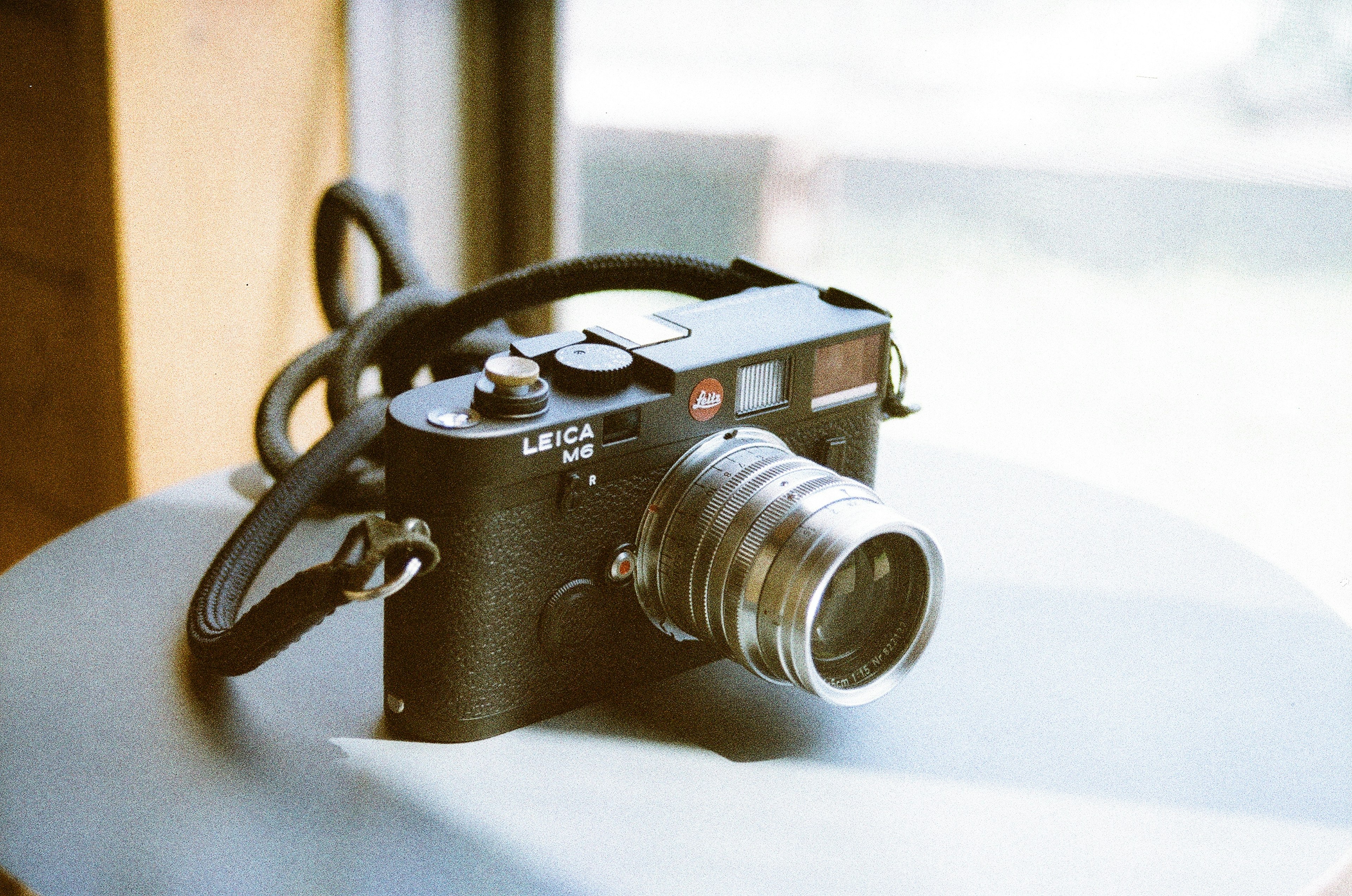 A retro camera is placed on a table