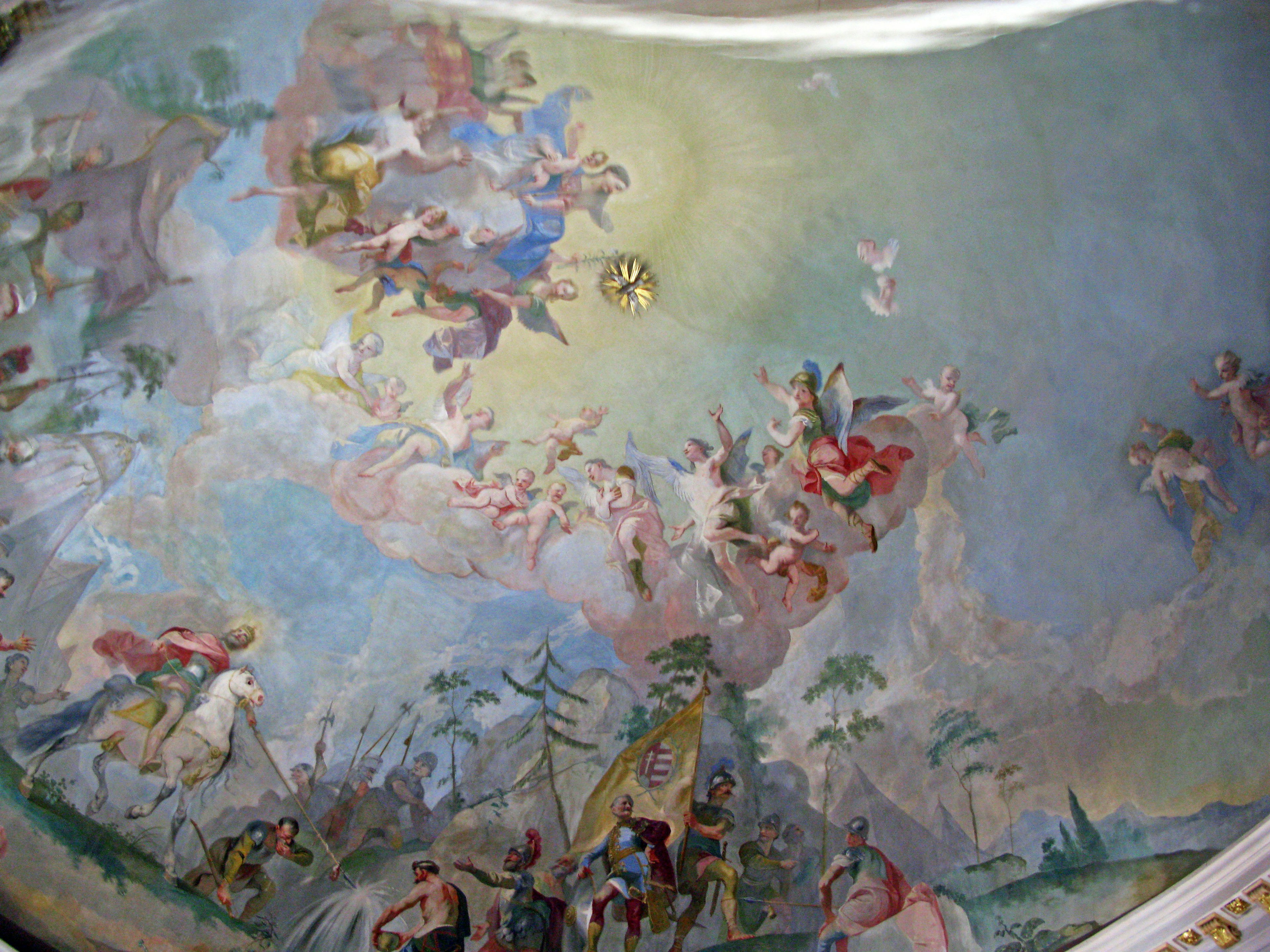 A beautiful ceiling painting depicting colorful angels and gods