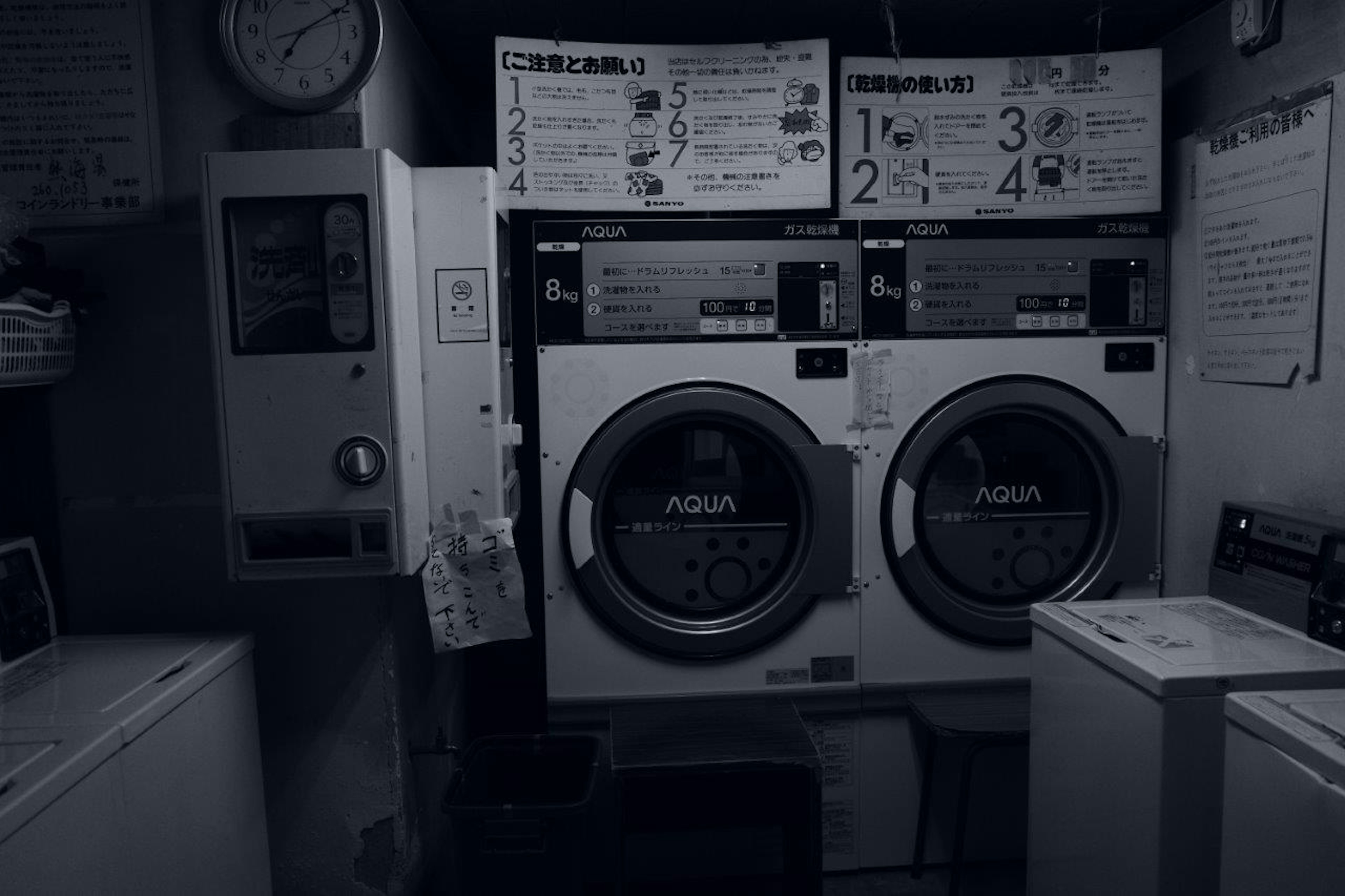 Interior of a laundry room with washing and drying machines