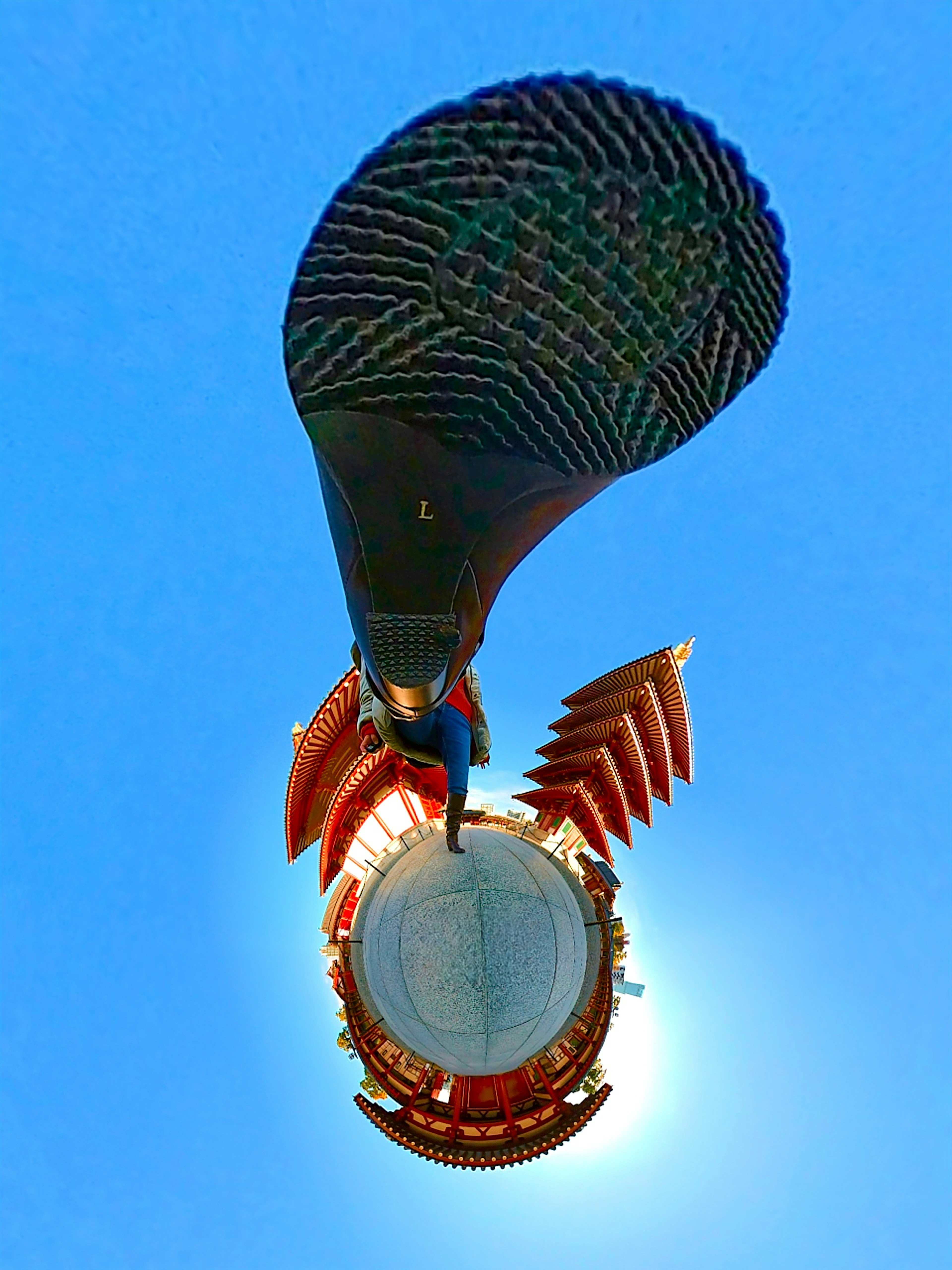 Colorful hot air balloon with decorative elements against a blue sky