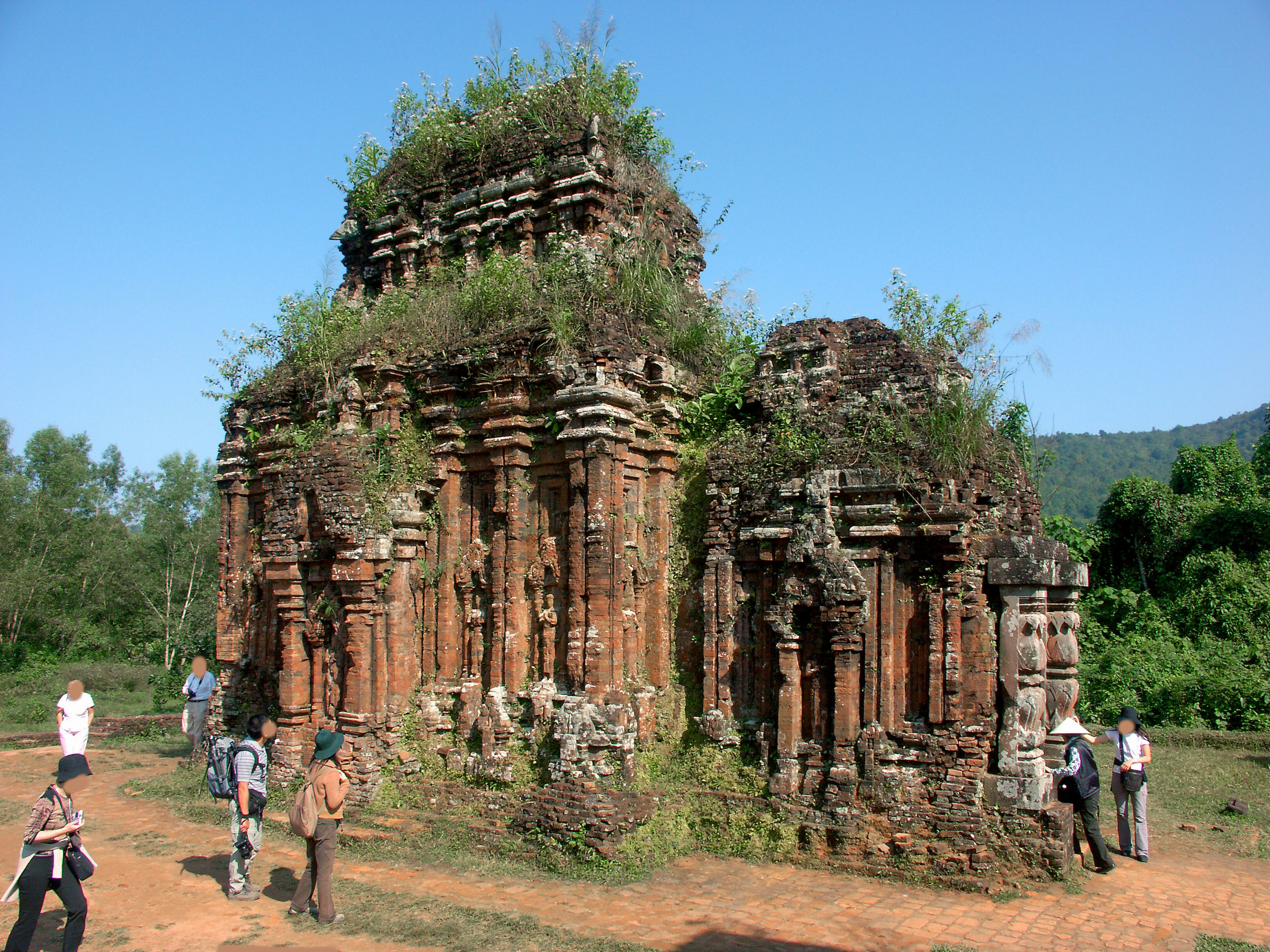 Ancient ruins with tourists exploring the site