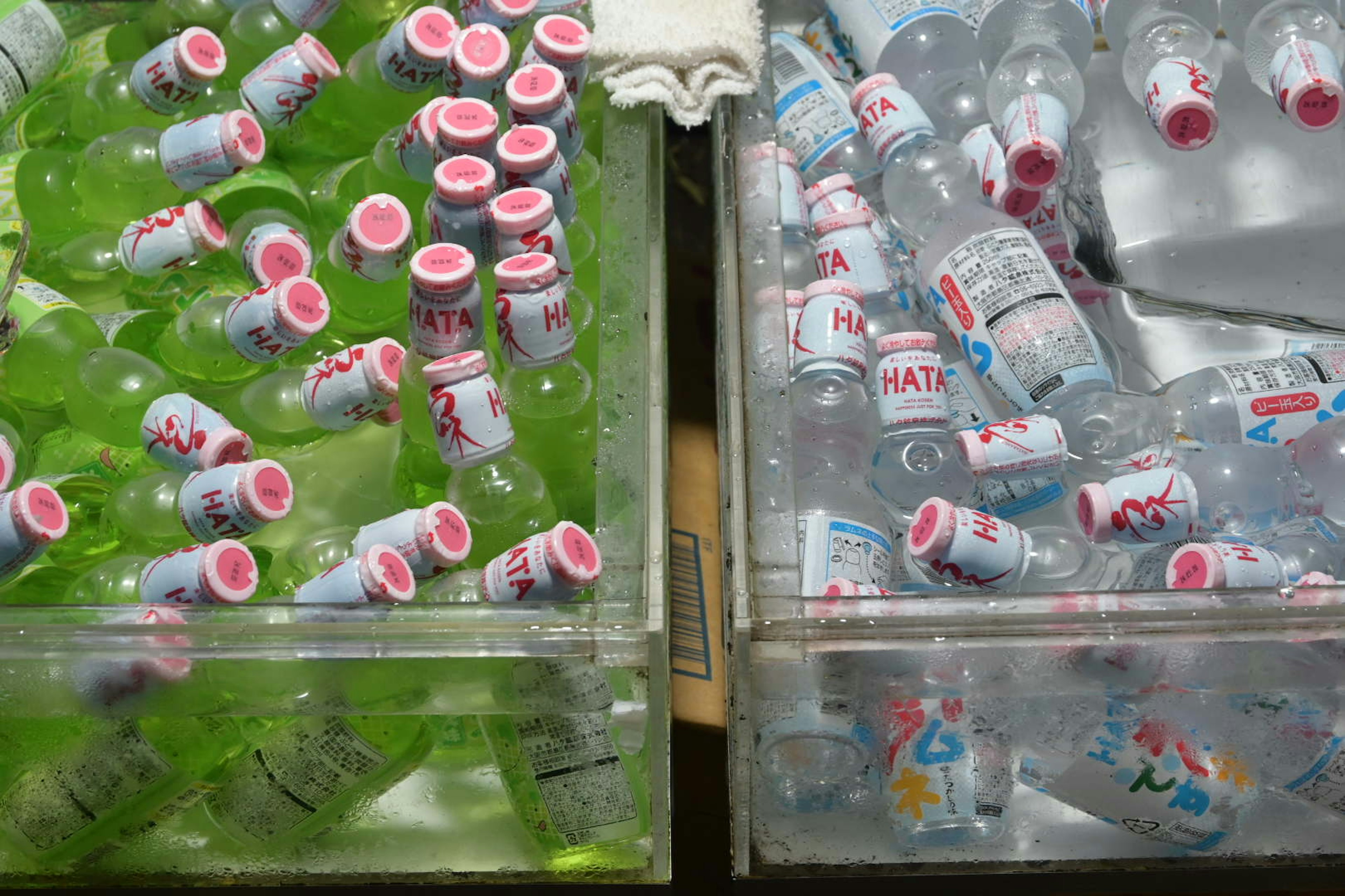 Colorful bottles in green liquid and water