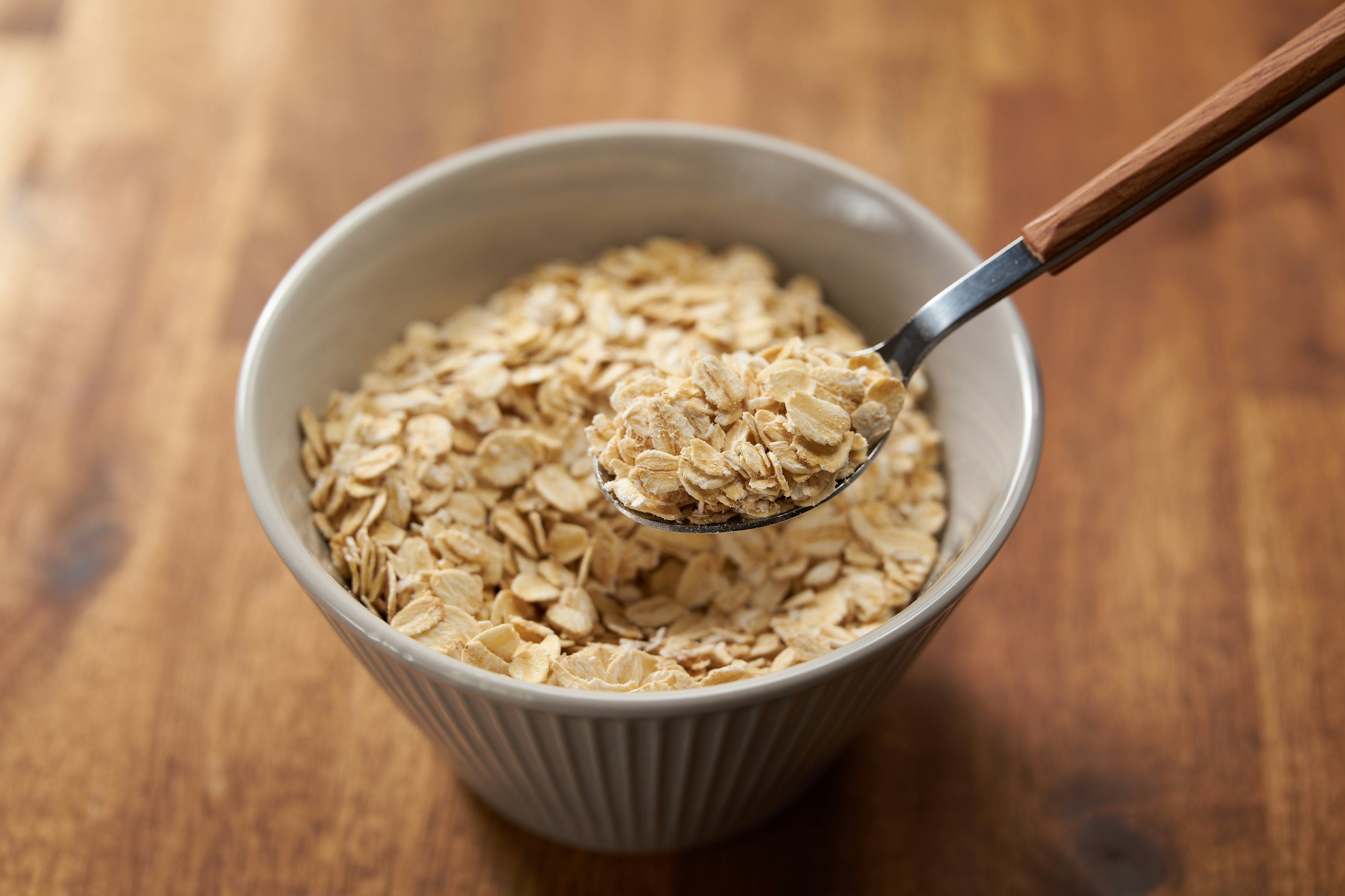 Bowl of oatmeal with a spoon resting inside