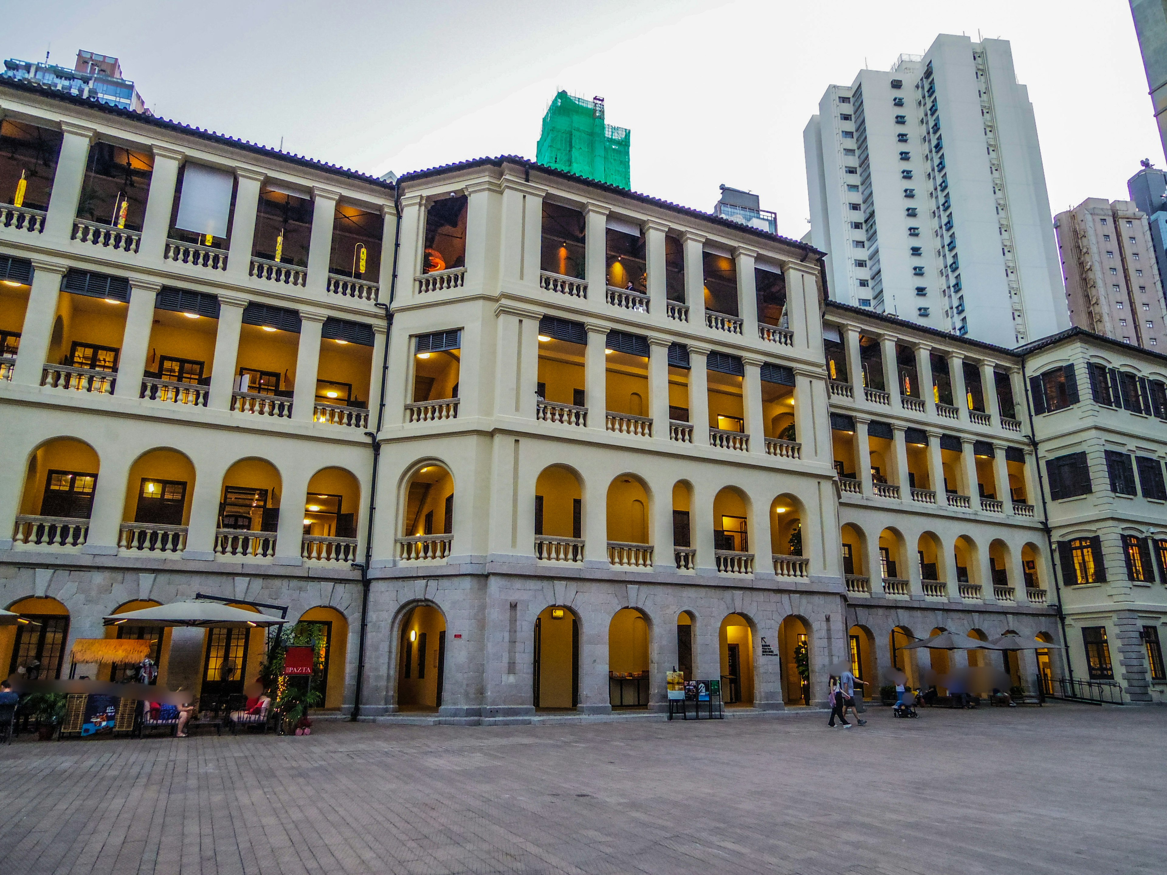 Photo of a historic building featuring arched windows and balconies