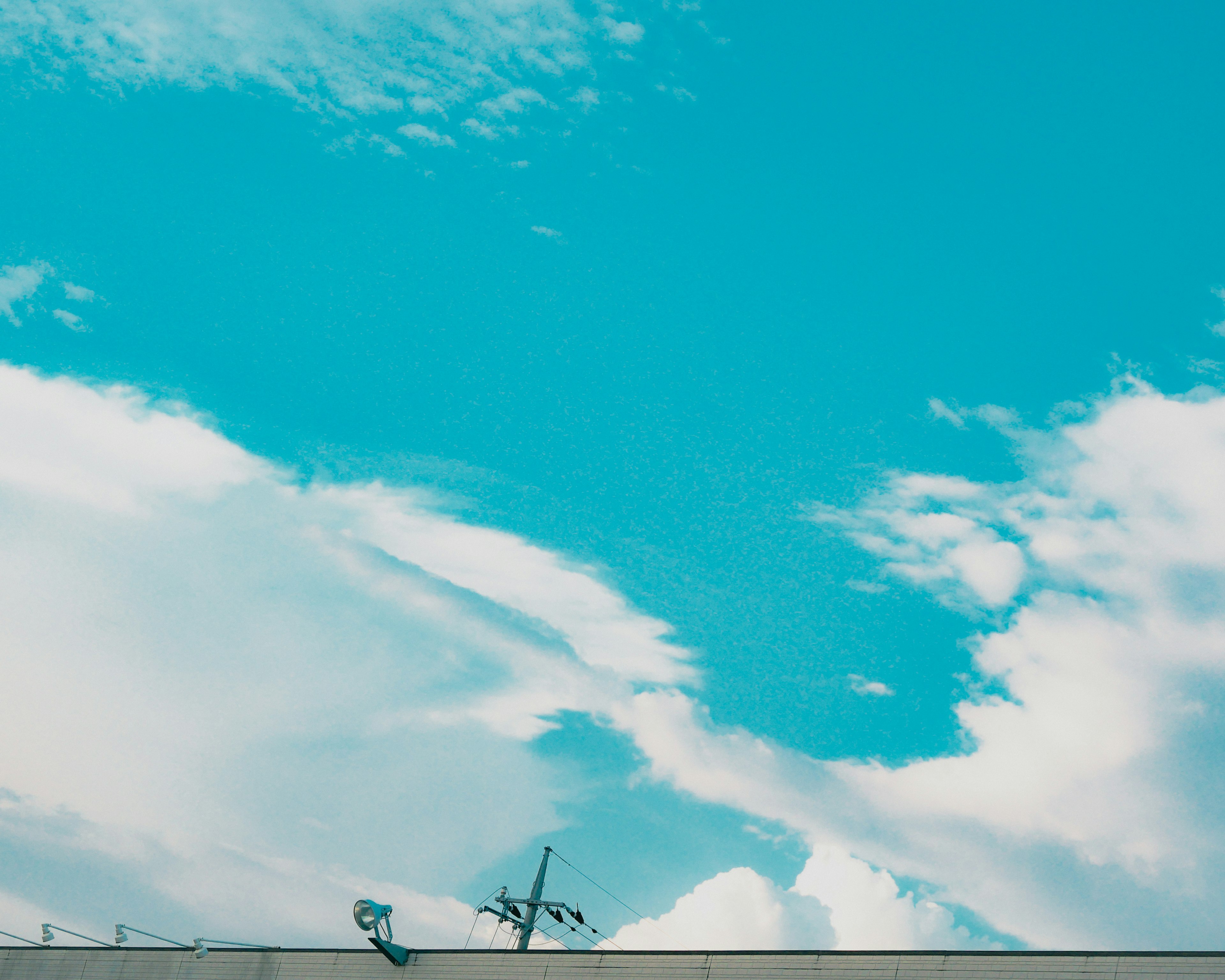 Vibrant blue sky with fluffy white clouds