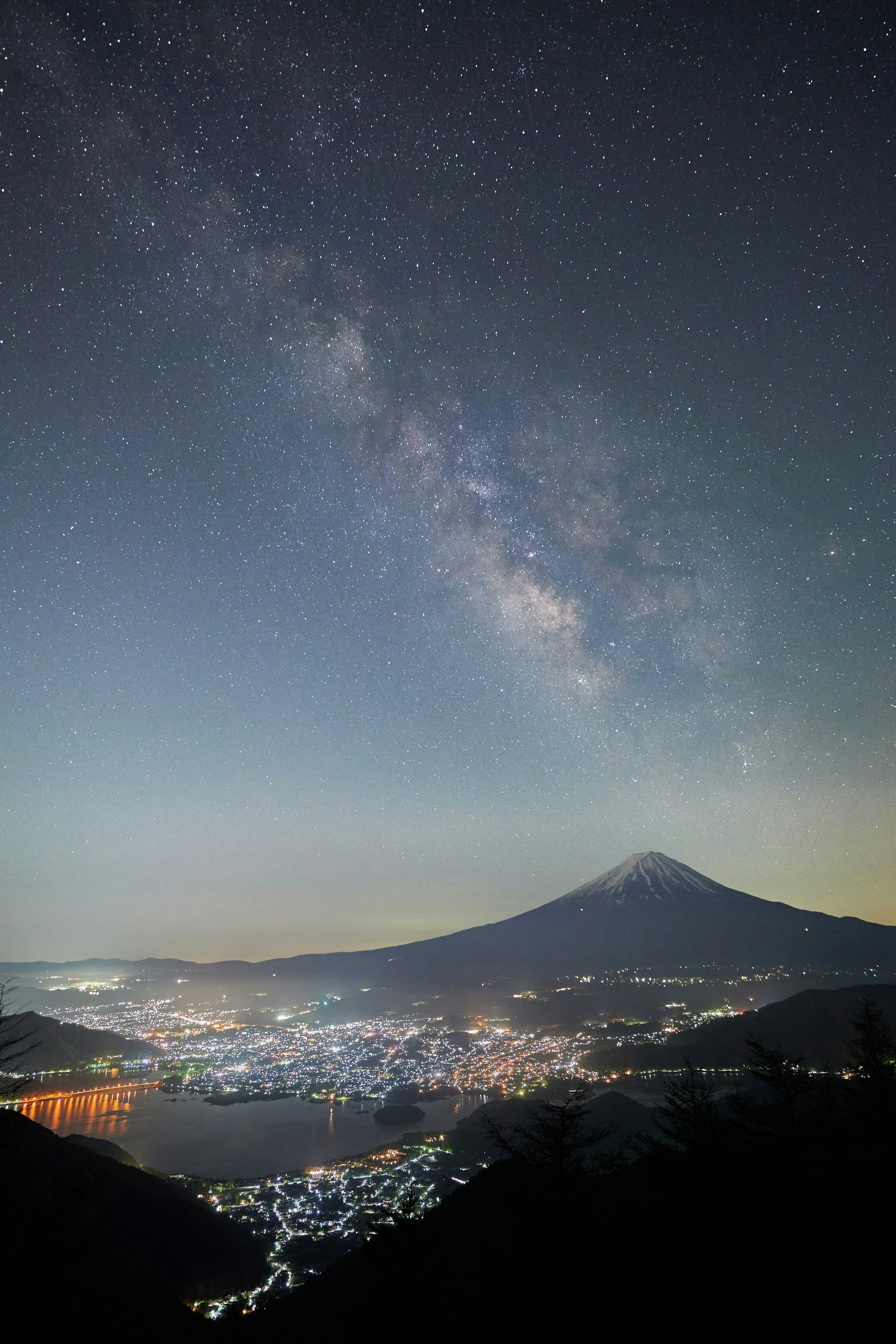 Milky Way over Mount Fuji with a cityscape