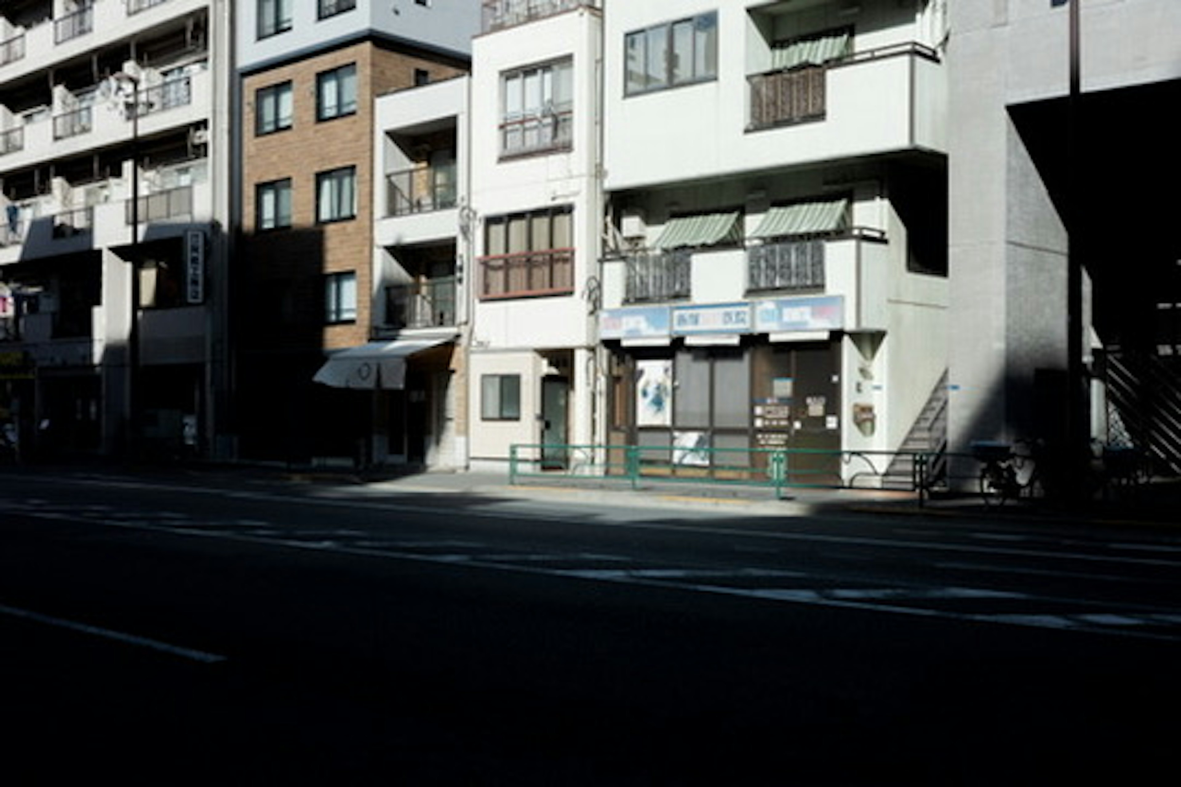 Quiet street scene with old buildings and shops